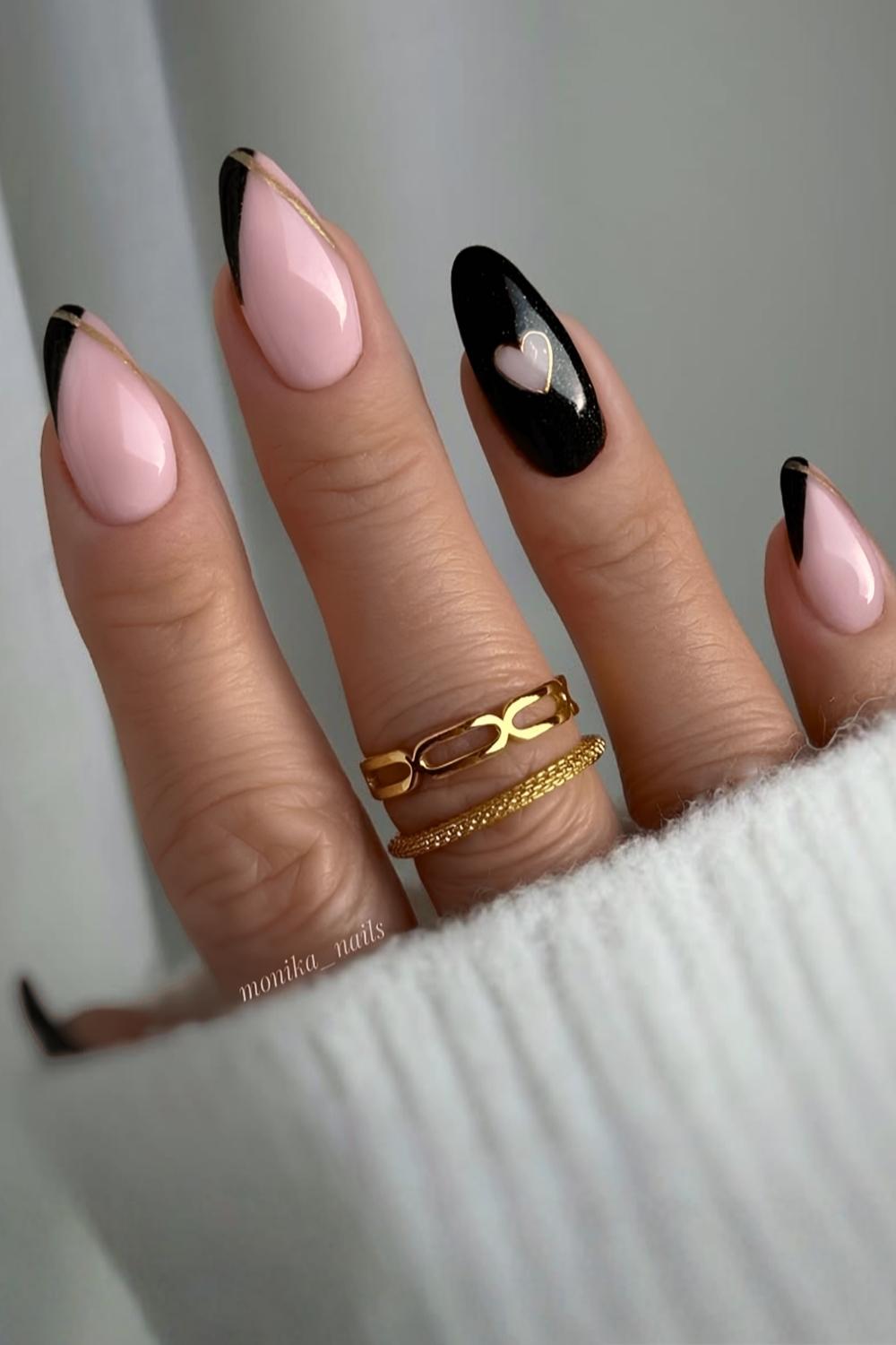 Black nails with heart and gold accents