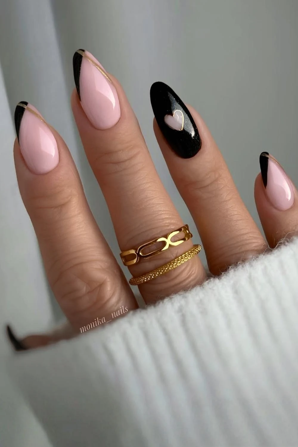 Black nails with heart and gold accents
