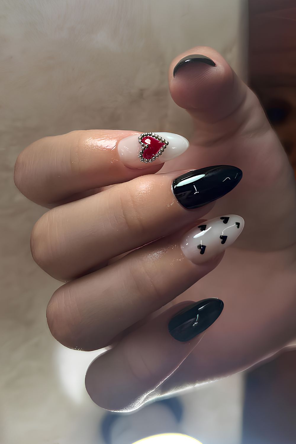 Black nails with white and red accents