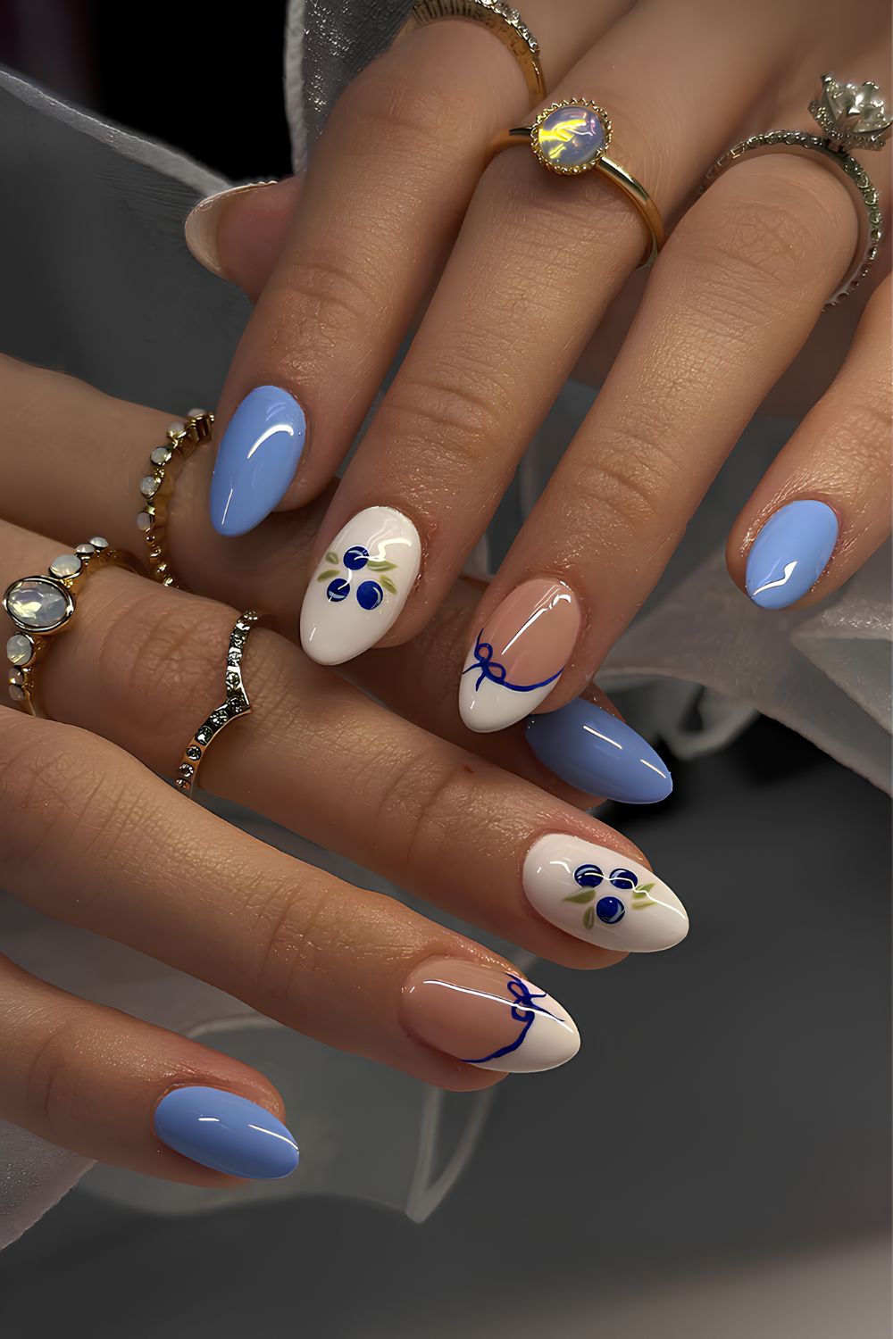 Blue and white mani with blueberry and bow art