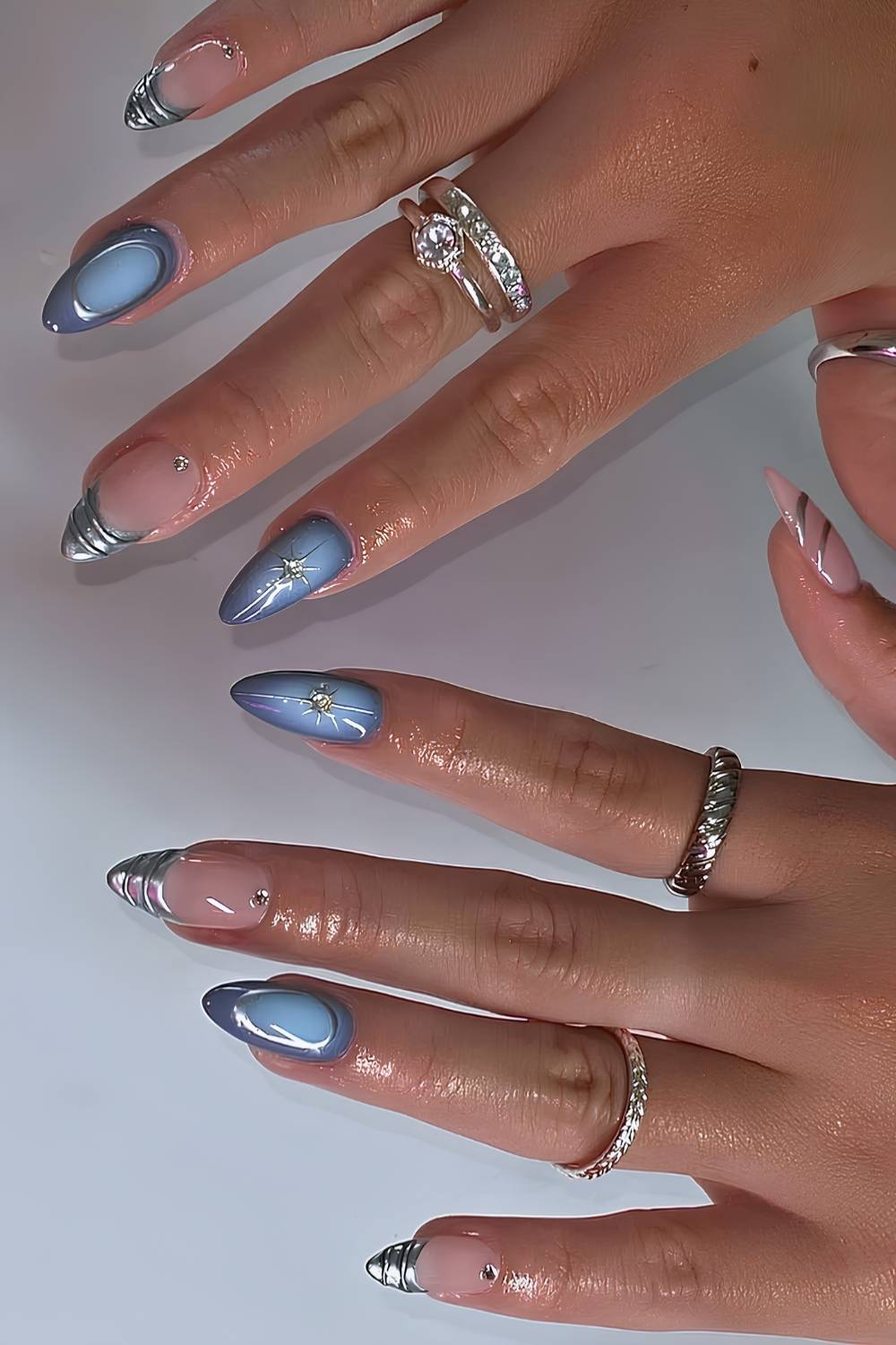 Blue aura nails with silver chrome accents