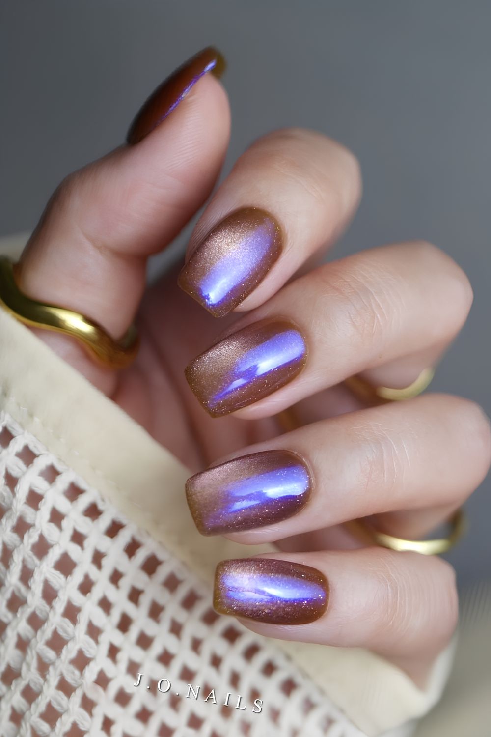 Brown and blue cateye nails