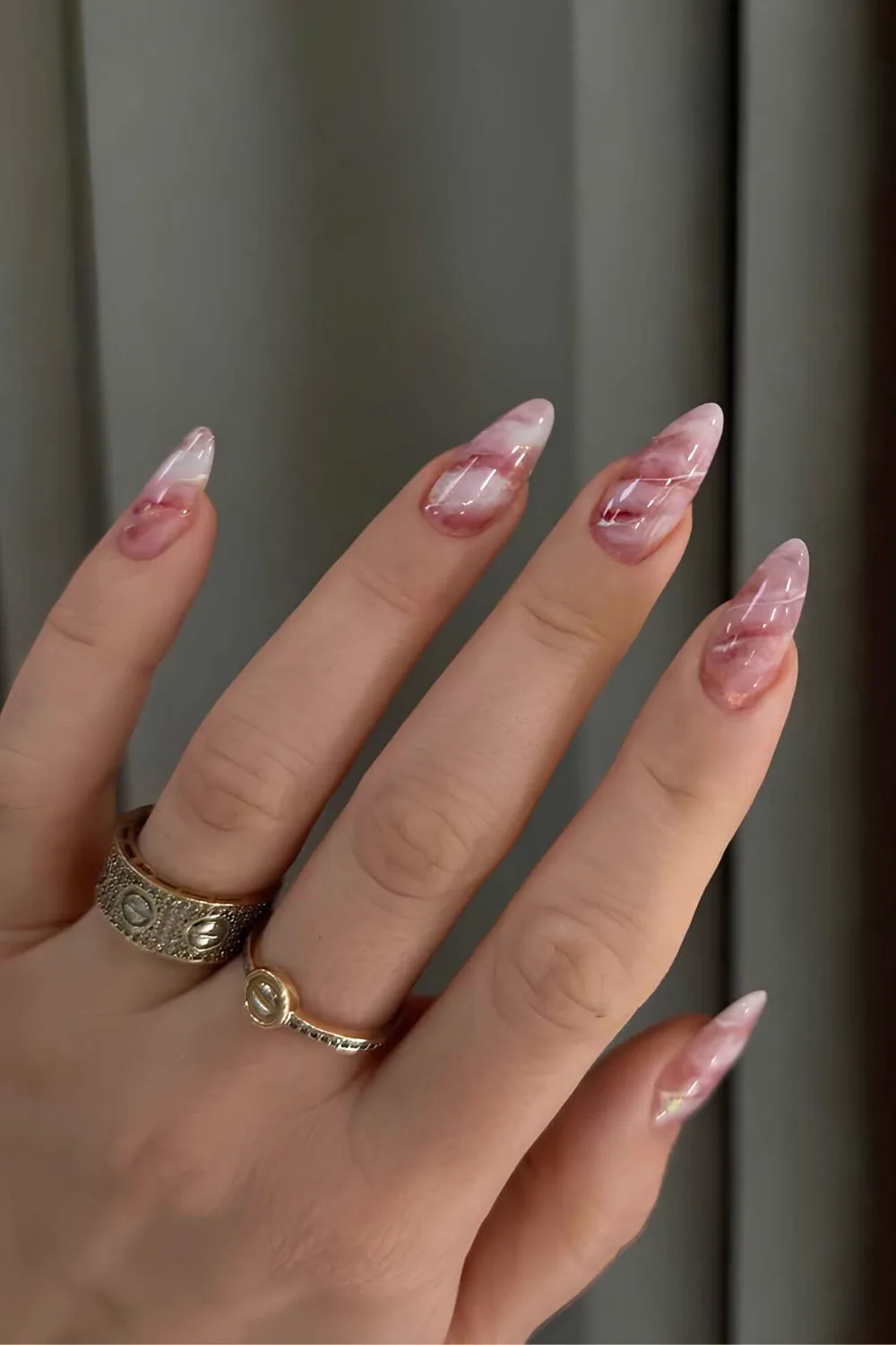 Bubblegum pink and white marble nails with swil design