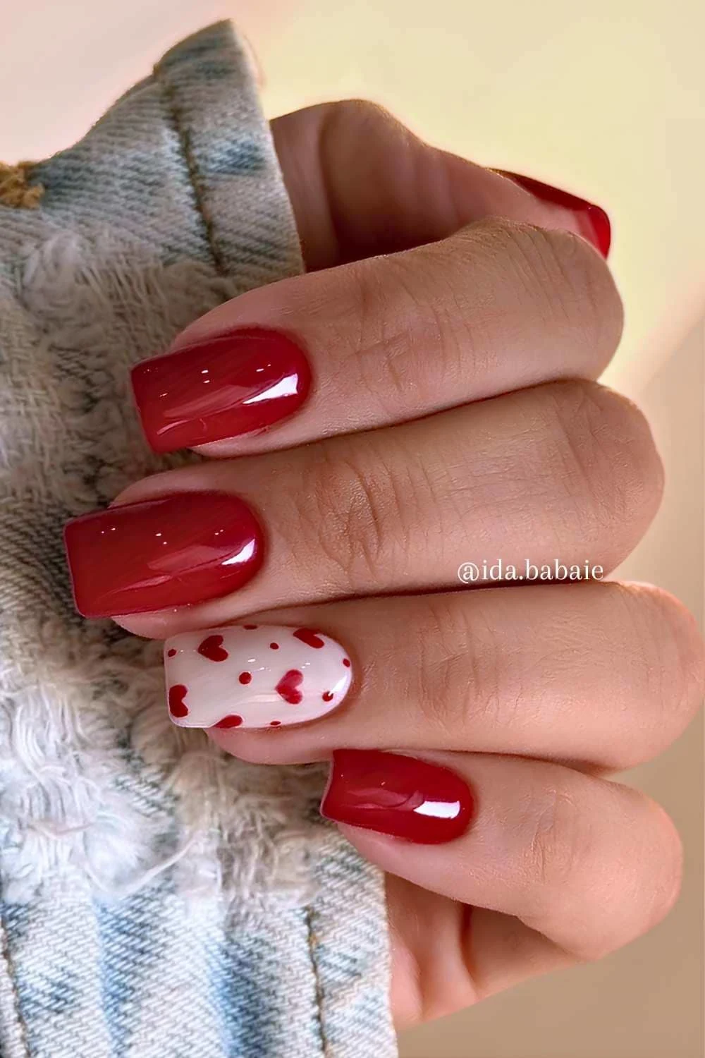 Cherry red mani with tiny hearts