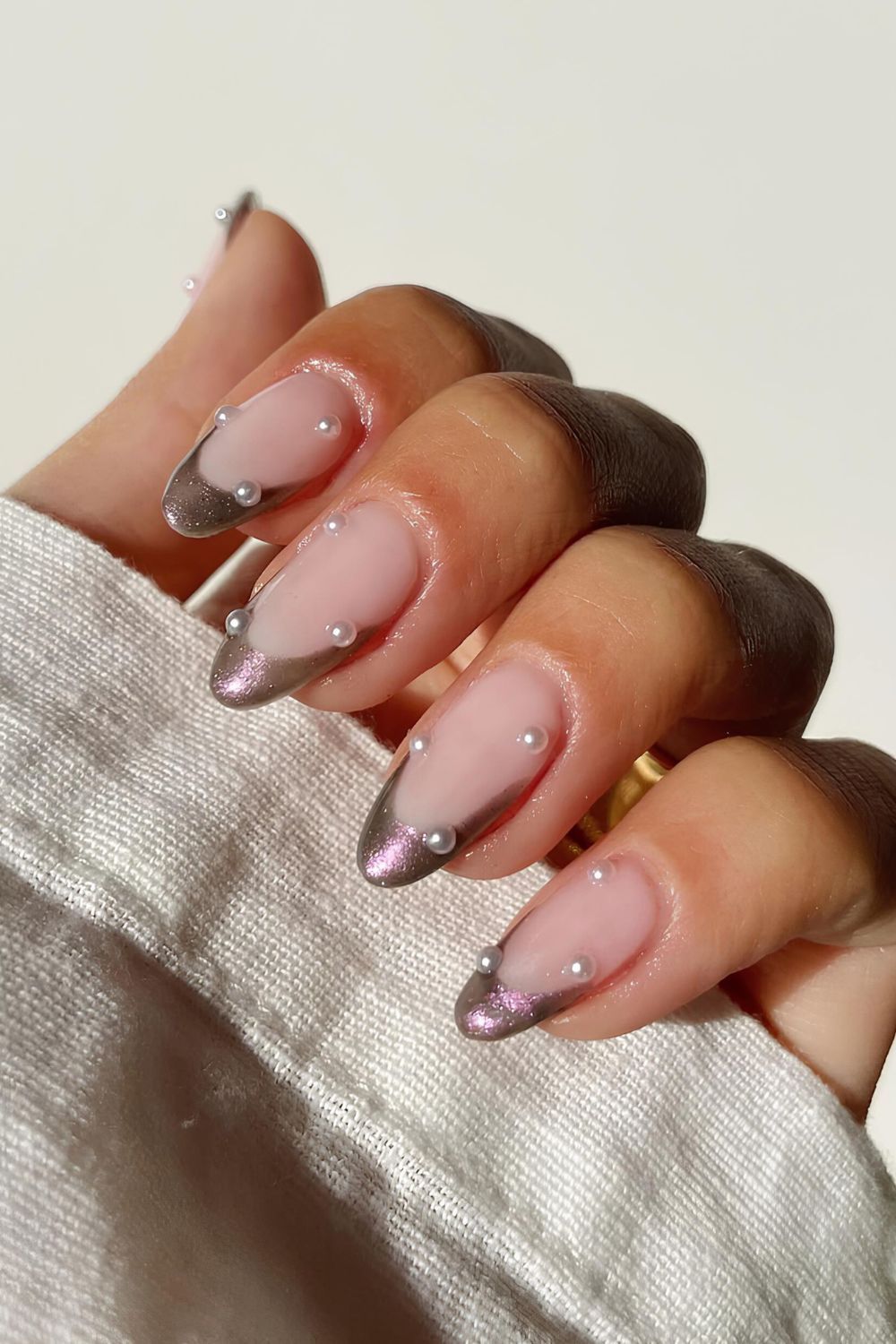 Chrome French tip nails with pearl accents