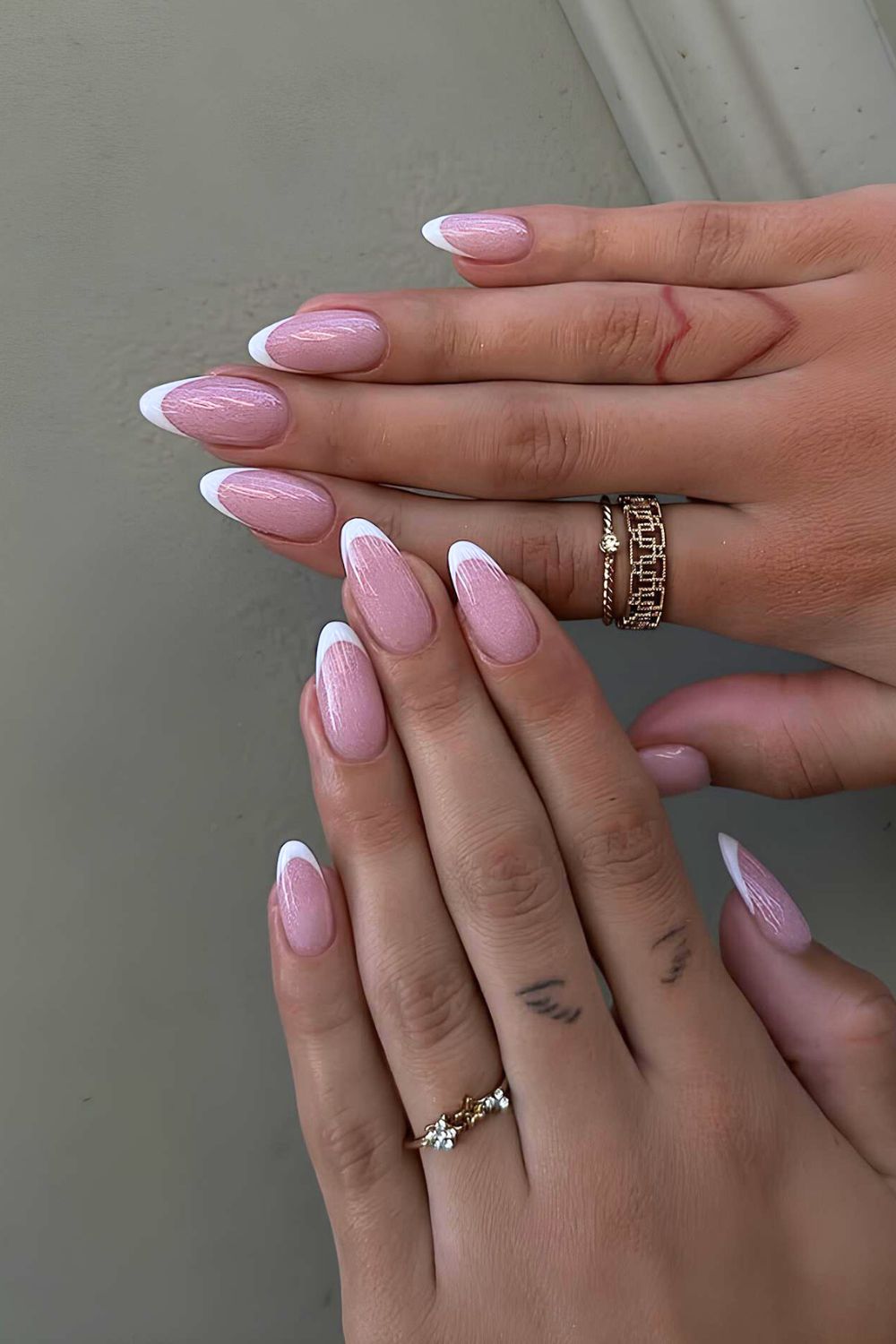 Classic white French mani with shimmery pink base