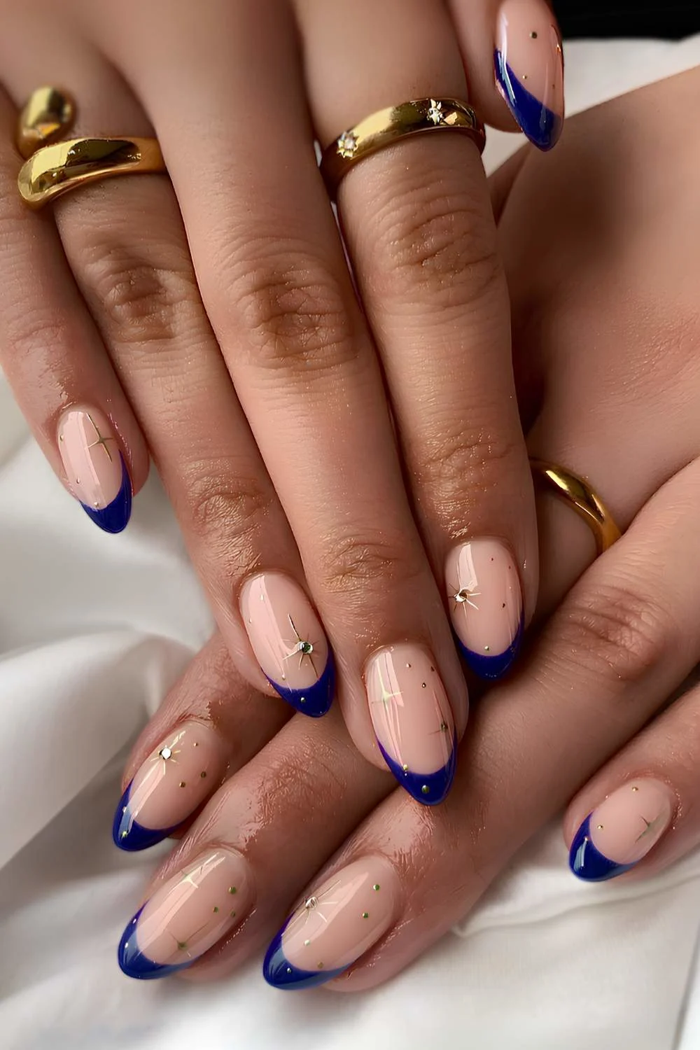 Dark blue French mani with celestial art