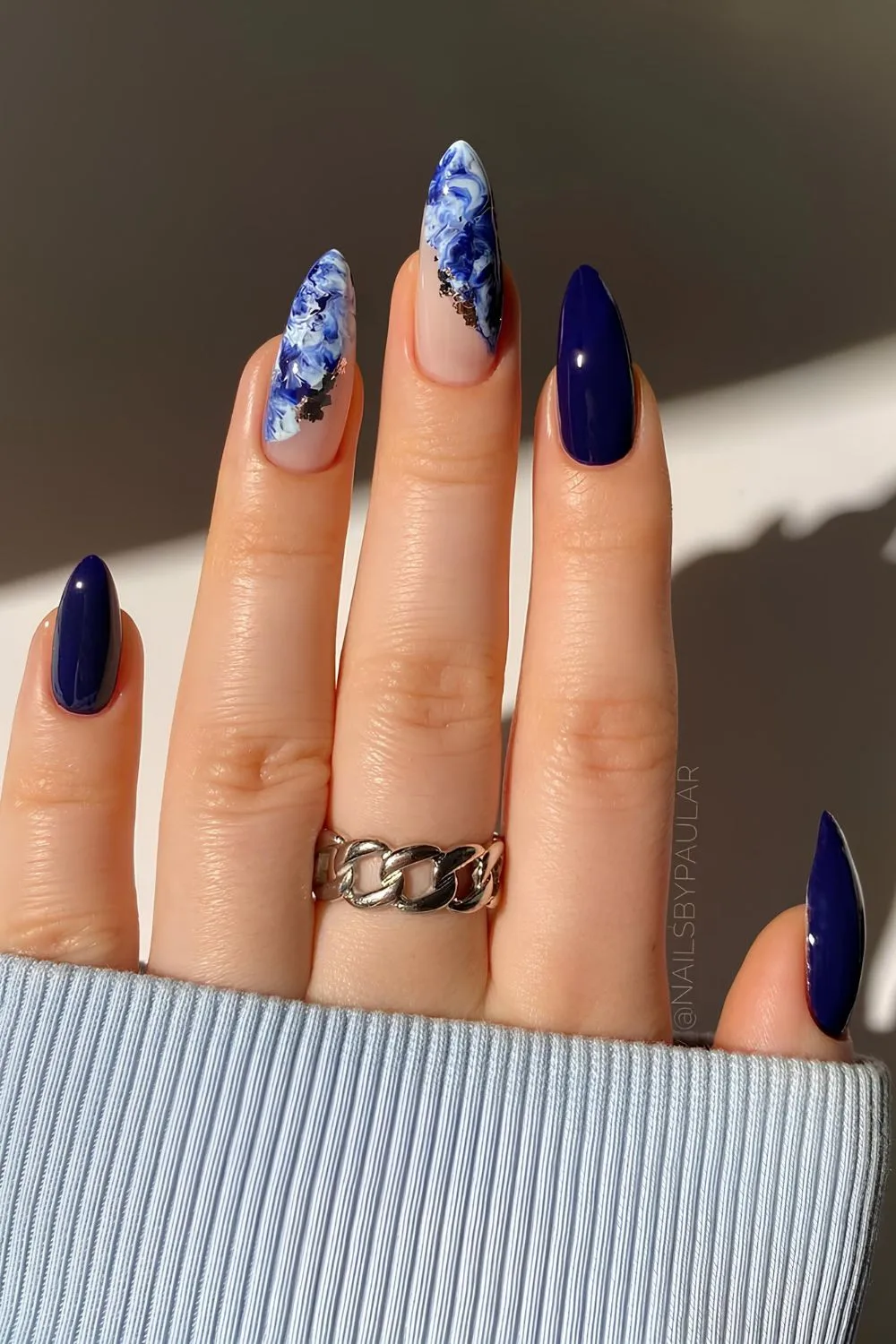 Dark blue and white marble nails