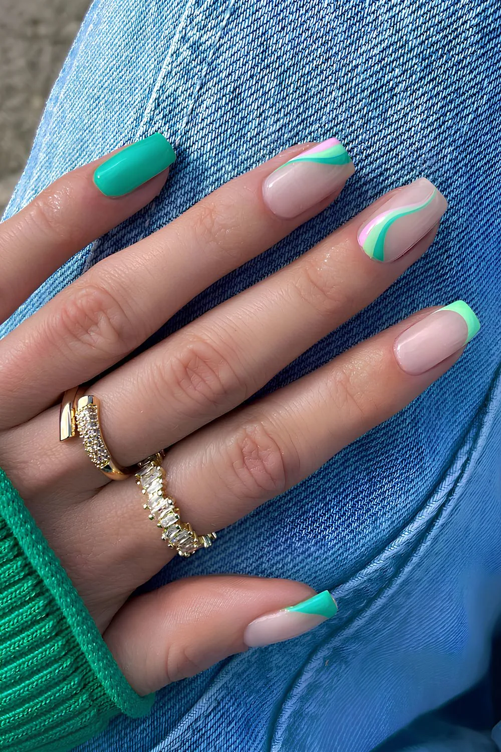 French and solid green mix nails with swirl accents