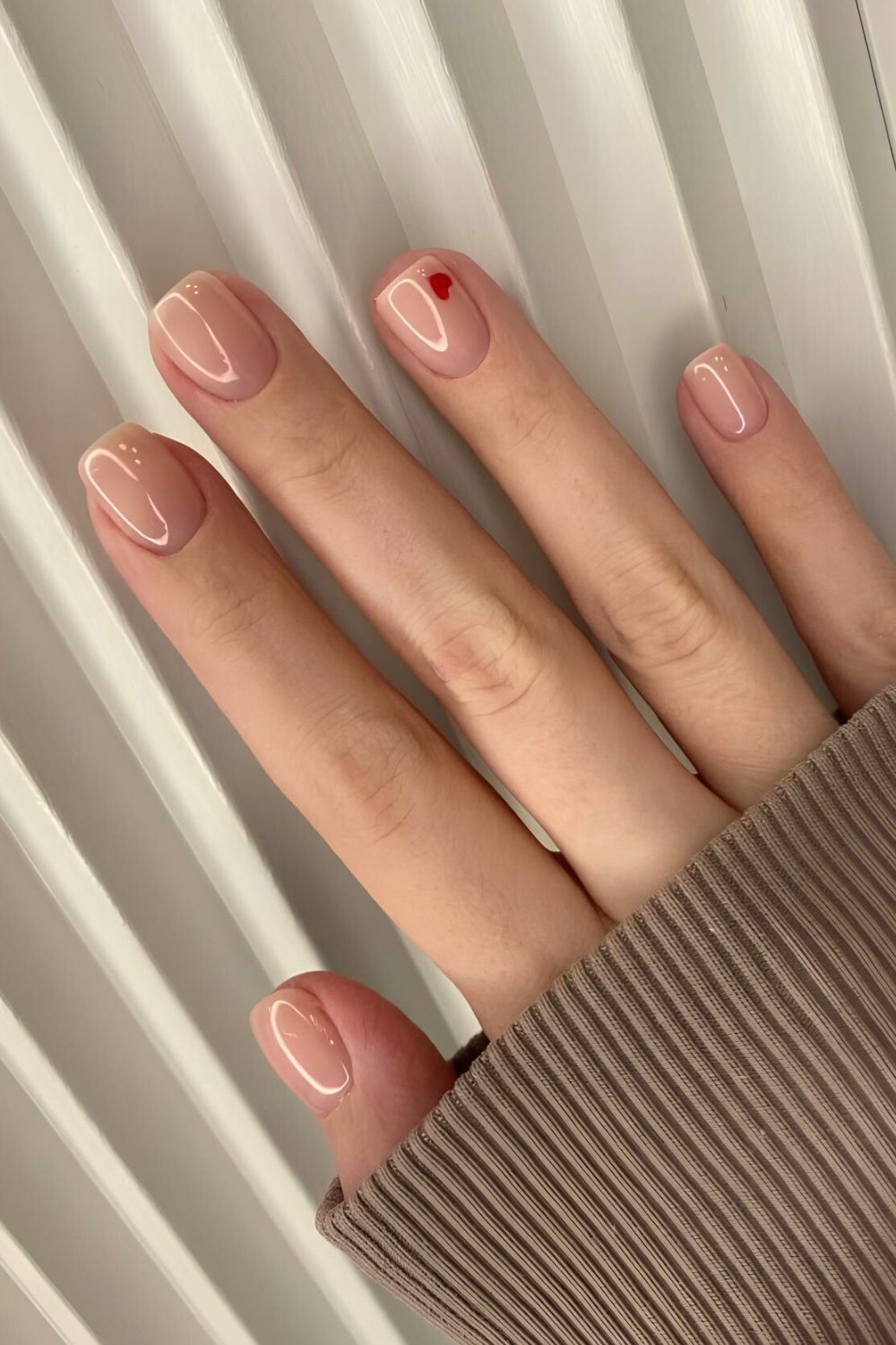 Glazed natural nails with red heart accent