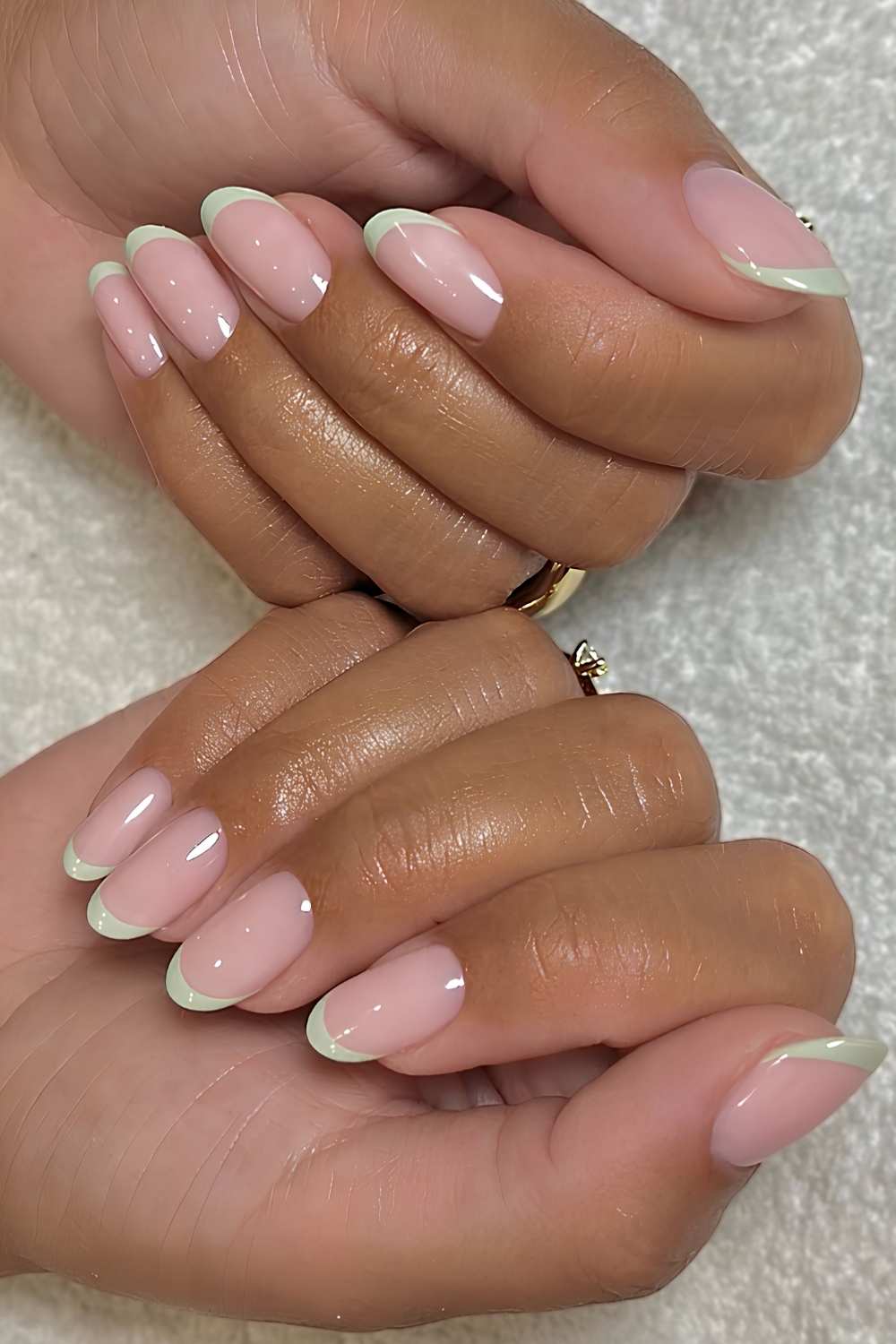 Glossy light green French manicure