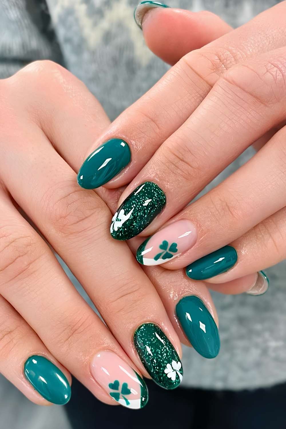 Green and white mani with glitter and clover art