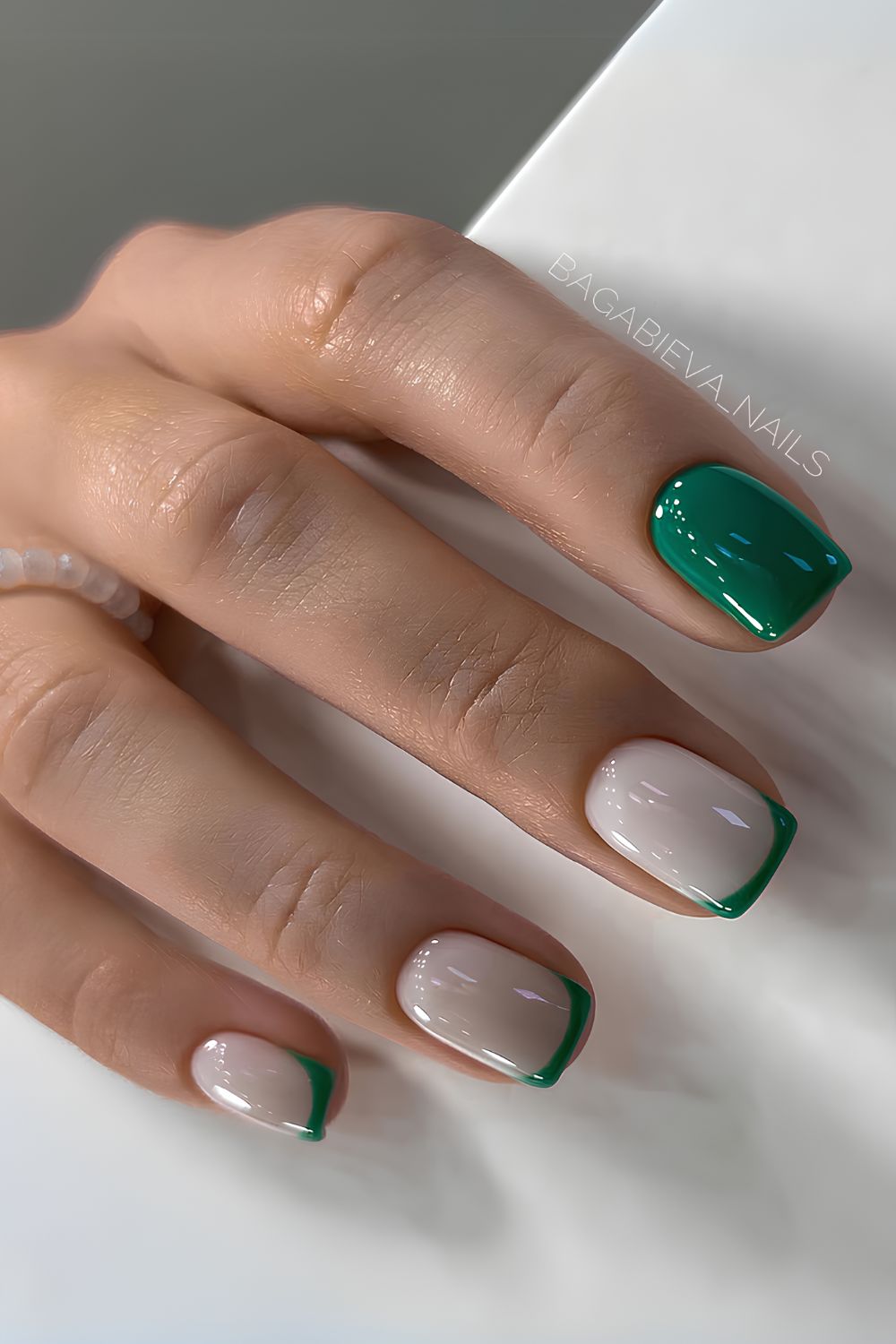 Green and white nails with accent French tips