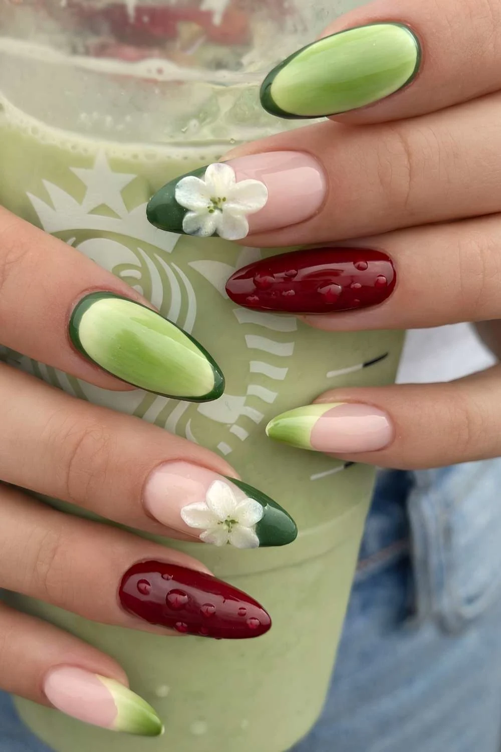 Green nails with burgundy and floral accents