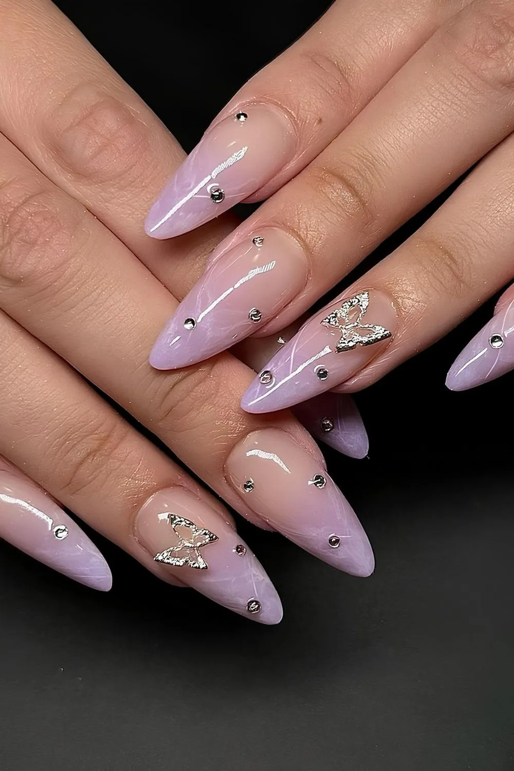 Lavender marble nails with rhiestone accents and butterfly