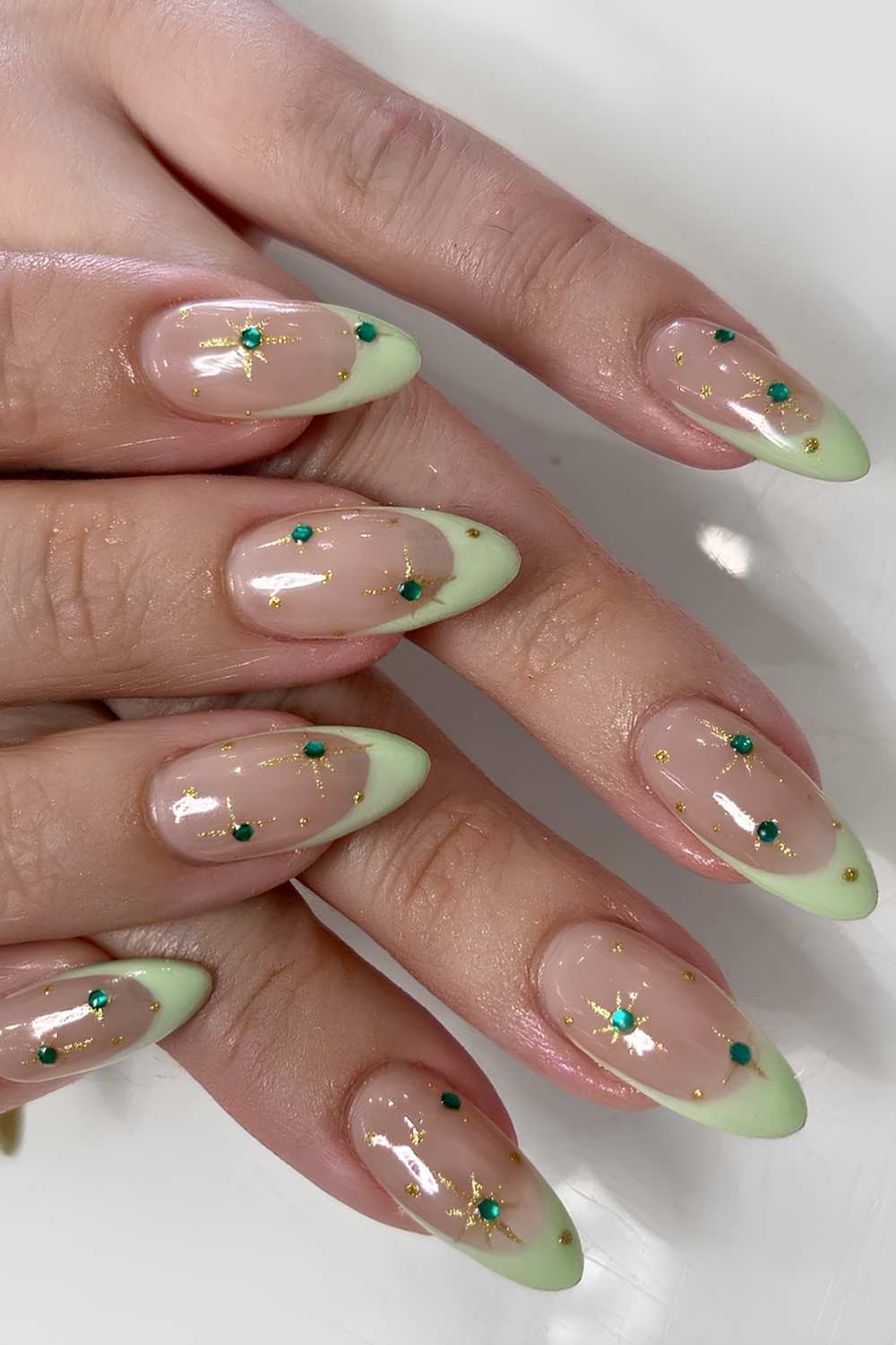Light green bedazzled French manicure