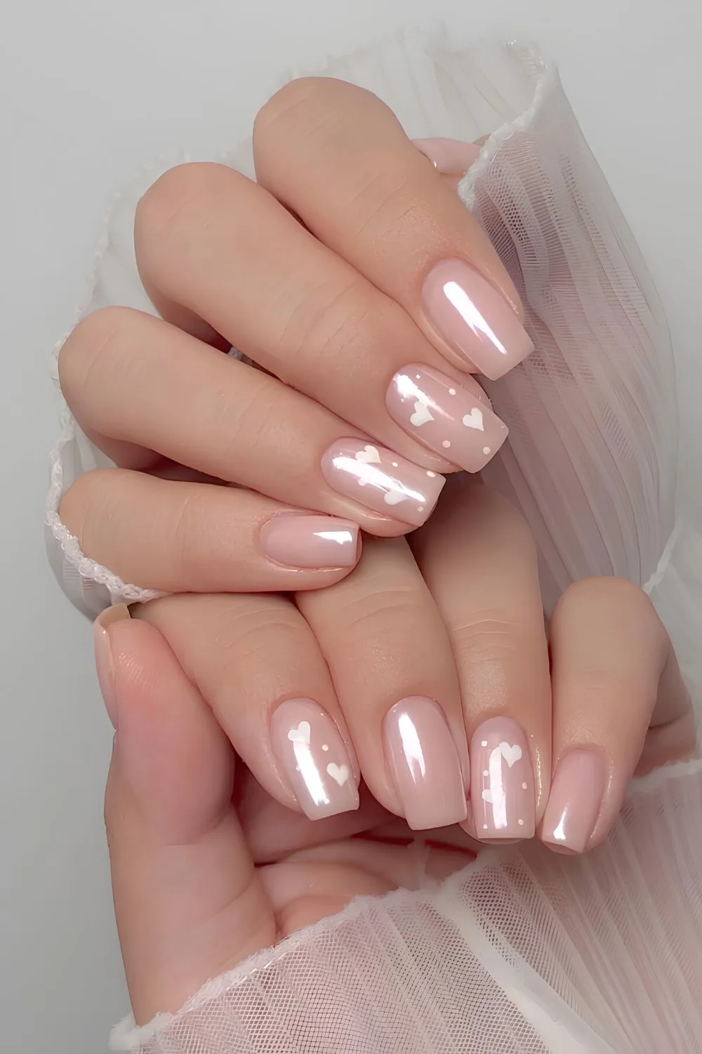 Milky pink chrome mani with hearts