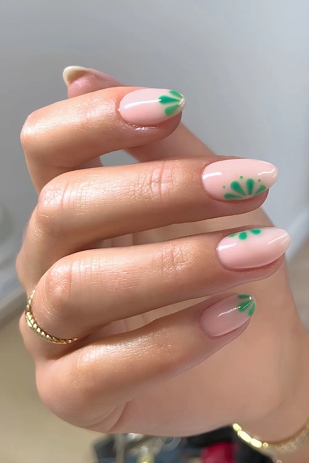 Milky pink mani with green floral accents