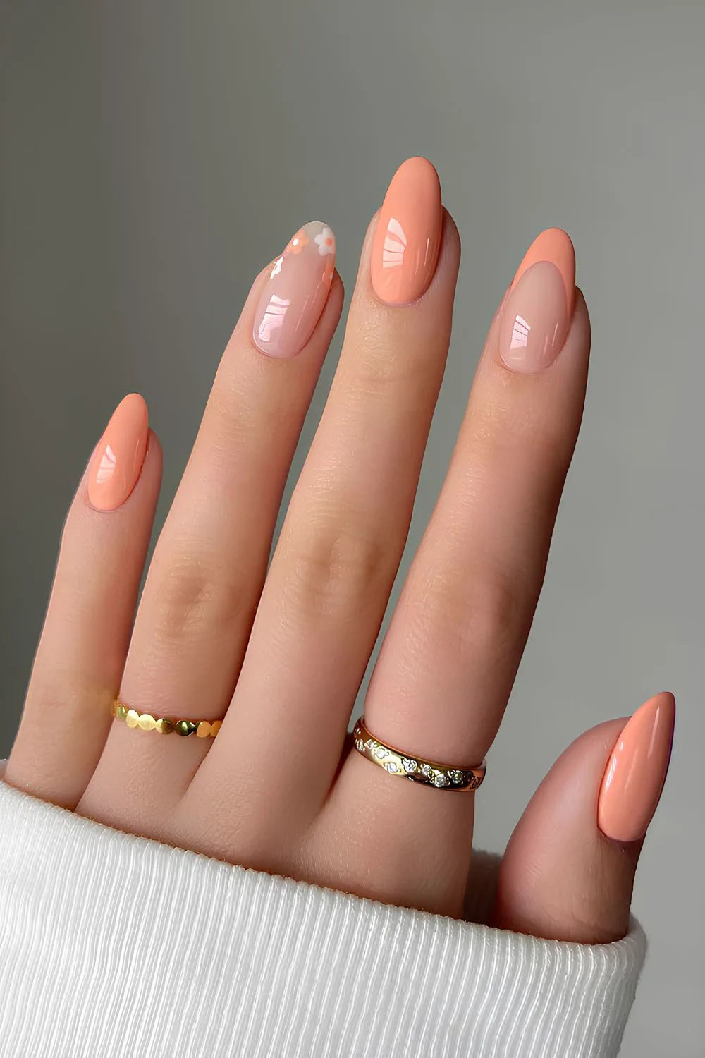 Peach manicure with floral accents