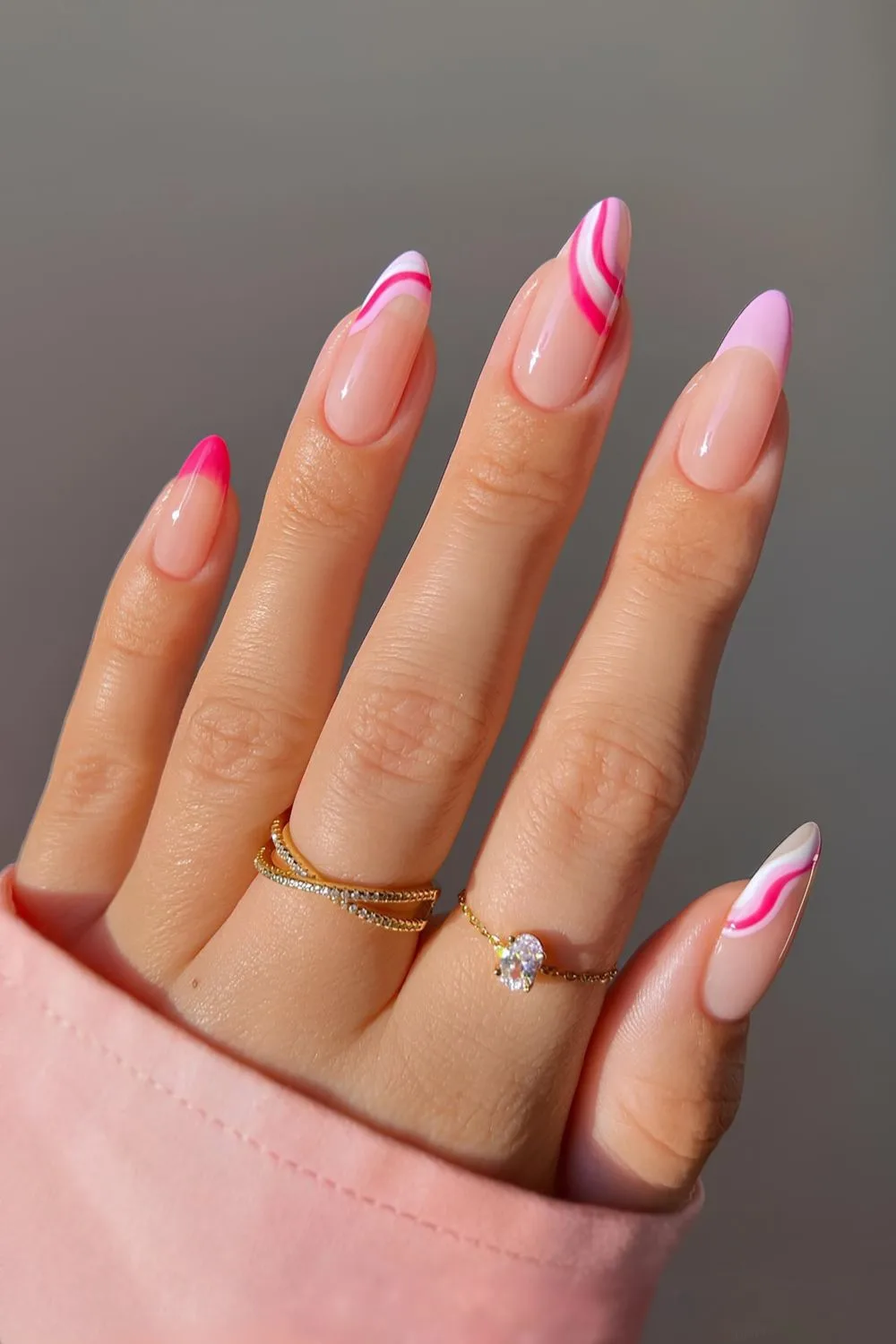 Pink French mani with swirl accents