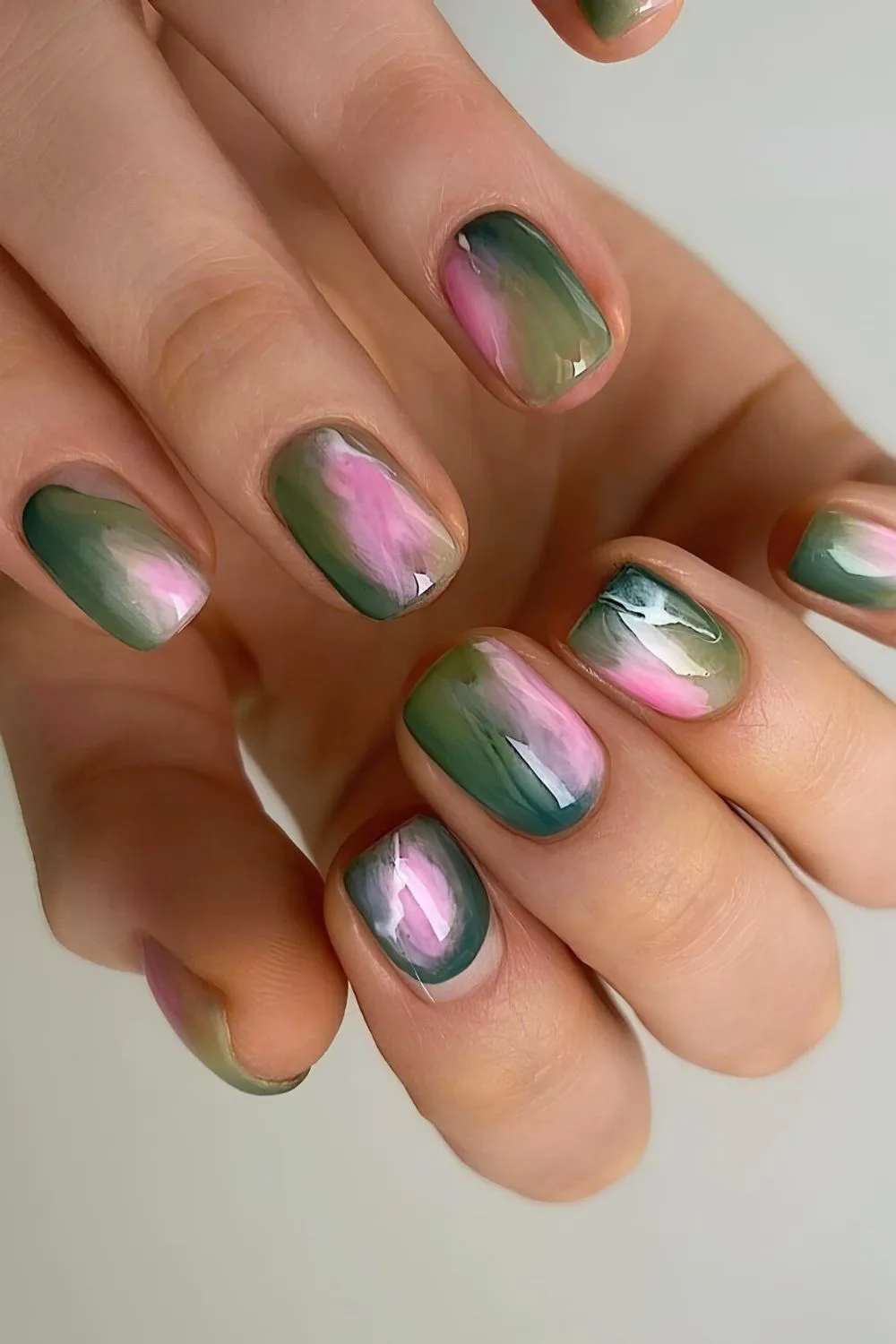 Pink and green marble nails