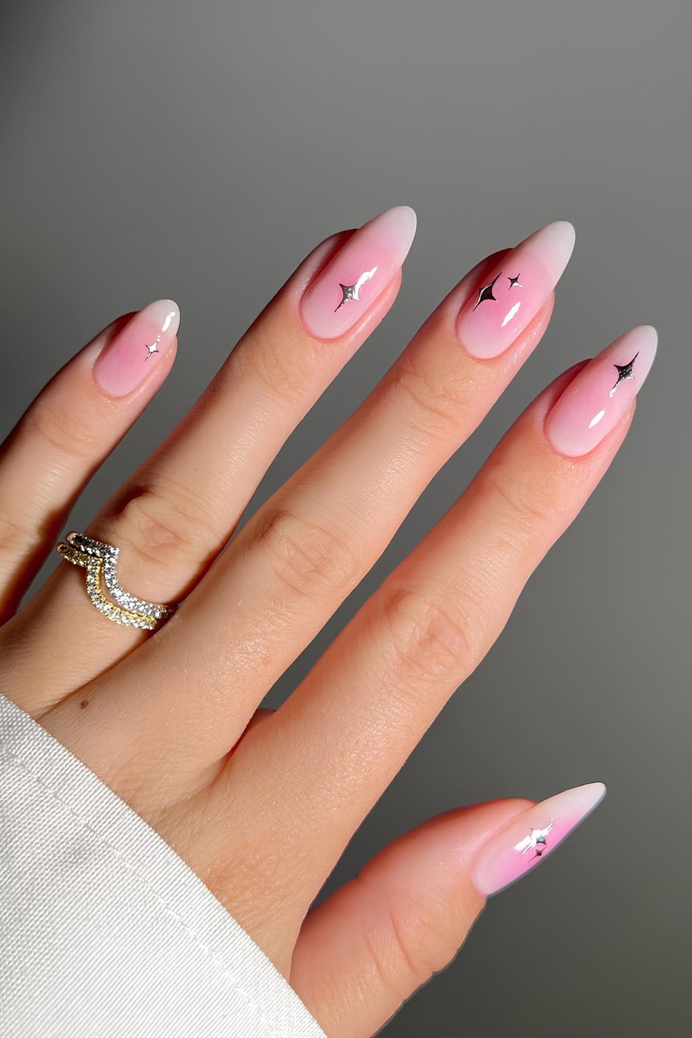 Pink aura nails with silver starburst details