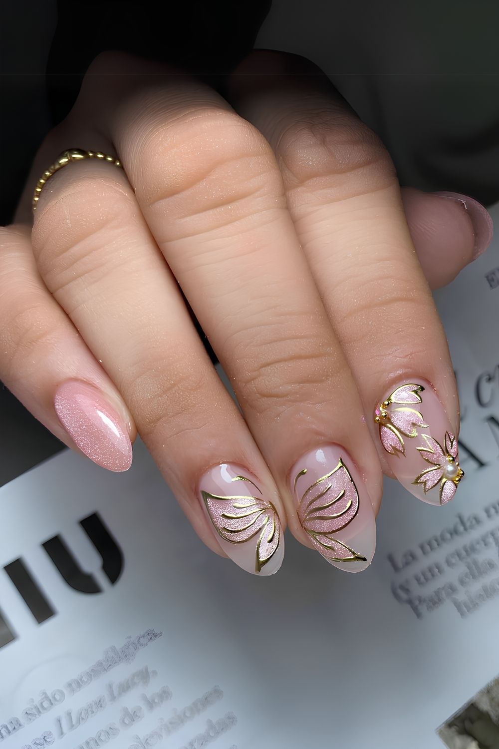 Pink cat eye nails with flowers and butterflies