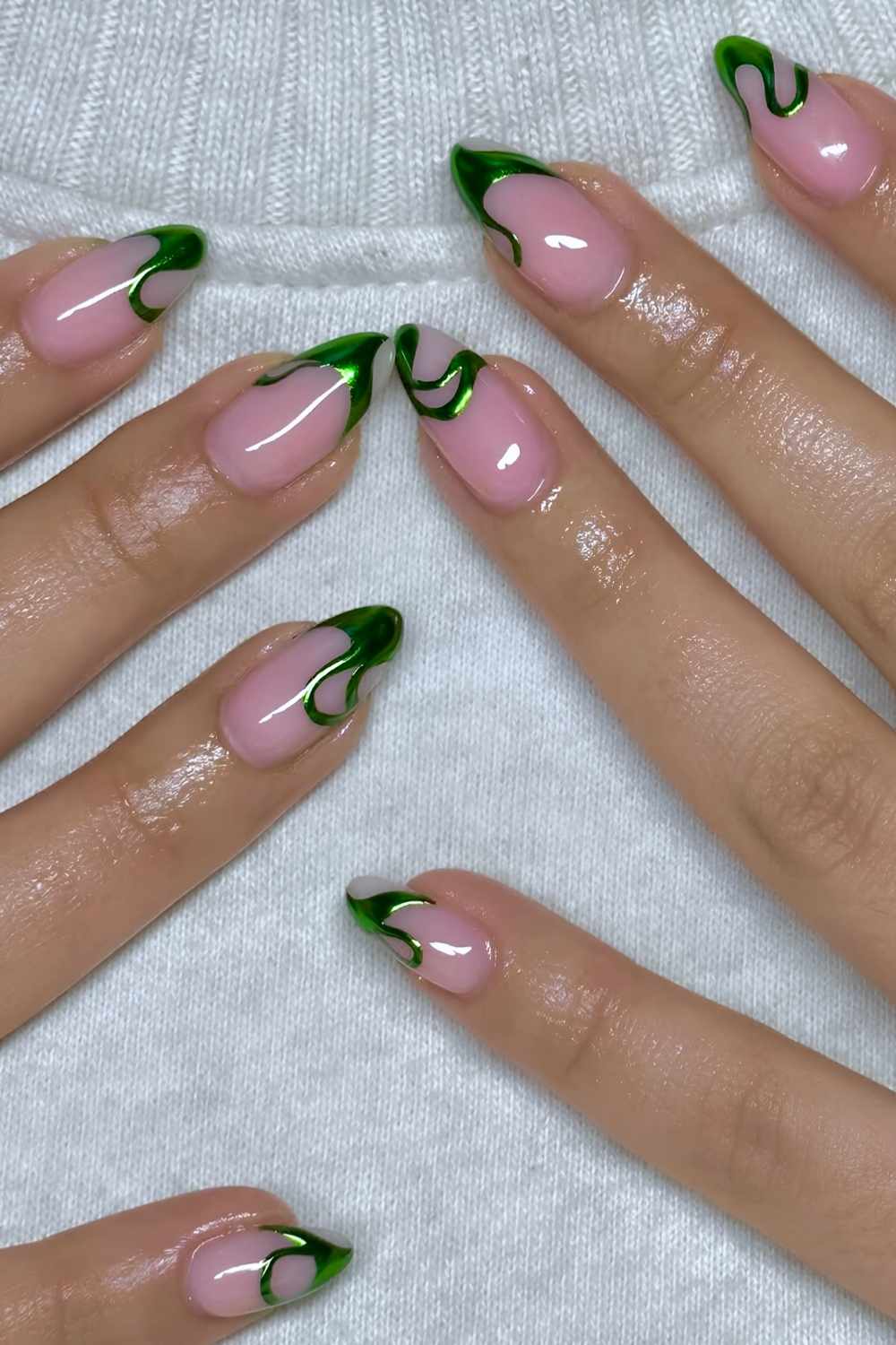 Pink mani with metallic green swirls