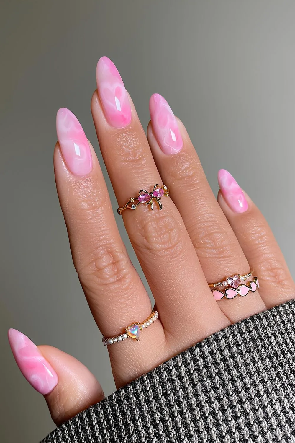 Pink marble nails with hidden heart accent