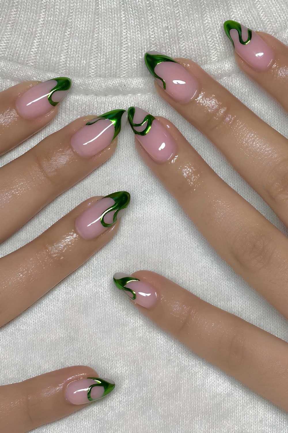 Pink nails with green chrome swirls