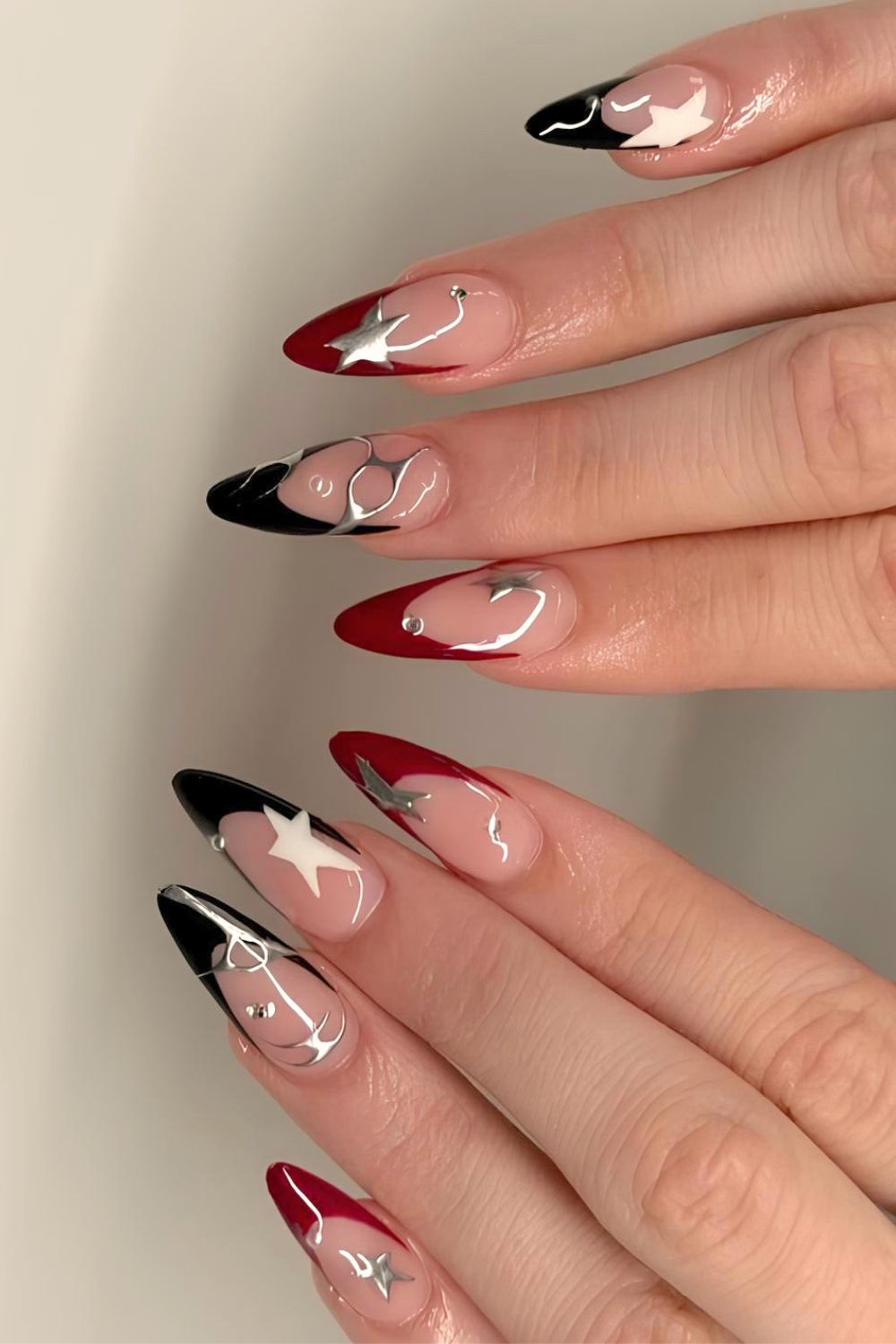 Red and black French nails with silver chrome accents