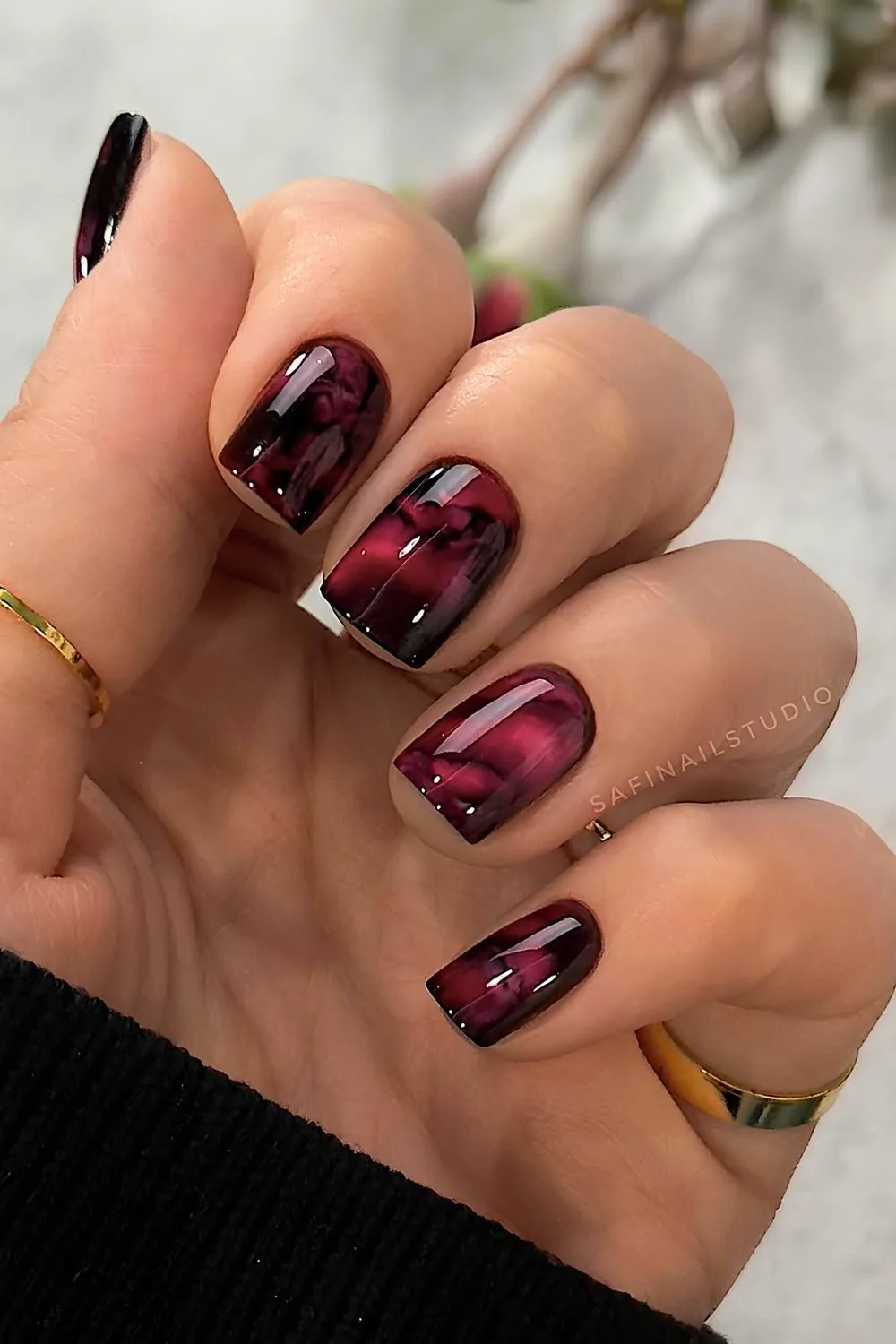 Red and black marble nails