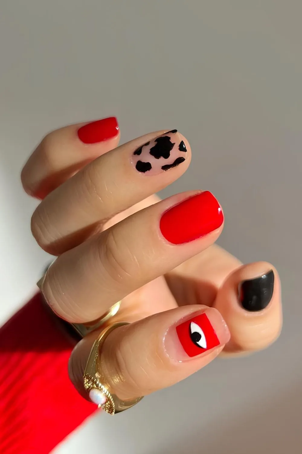 Red and black nails with animal print