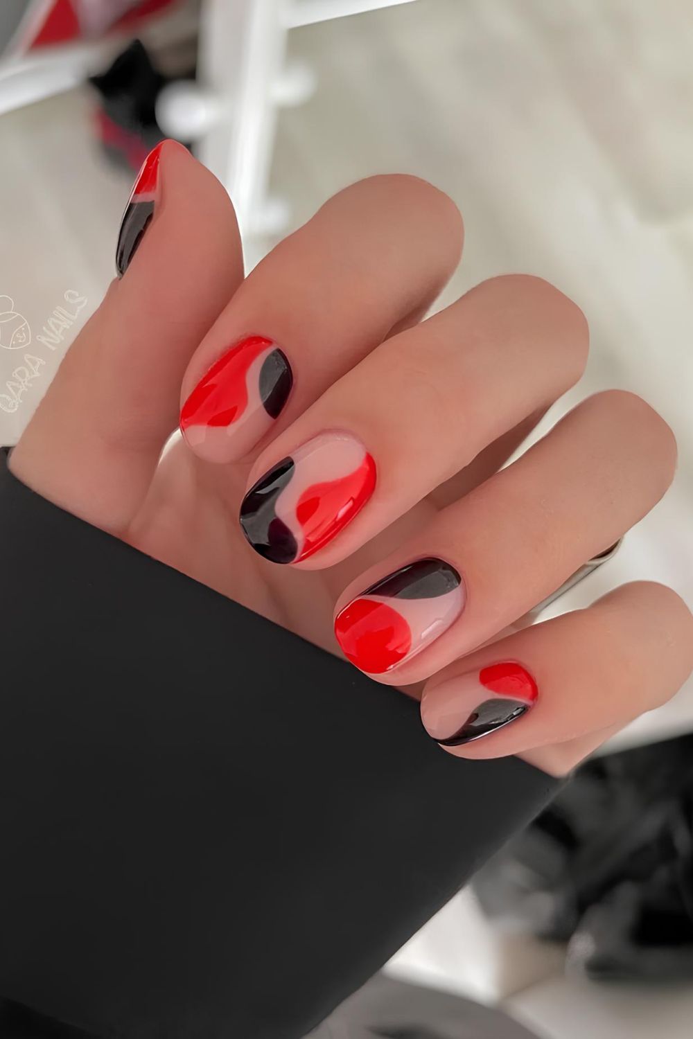 Red and black nails with negative space