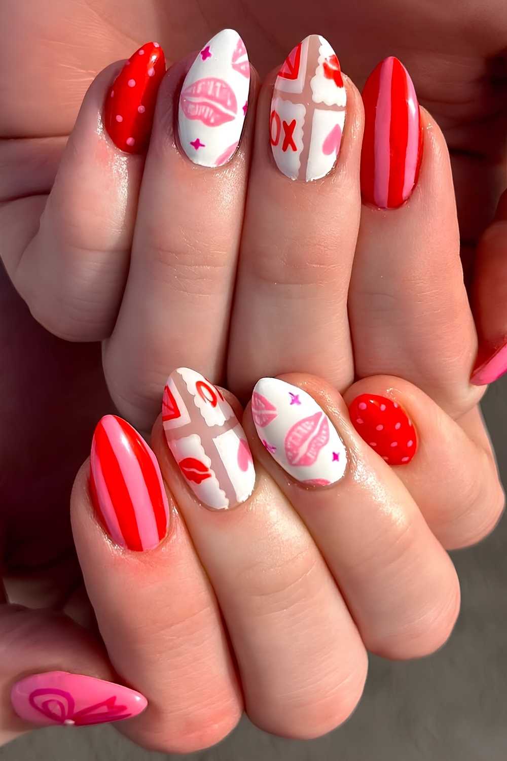 Red and white nails with stripe and kissy art