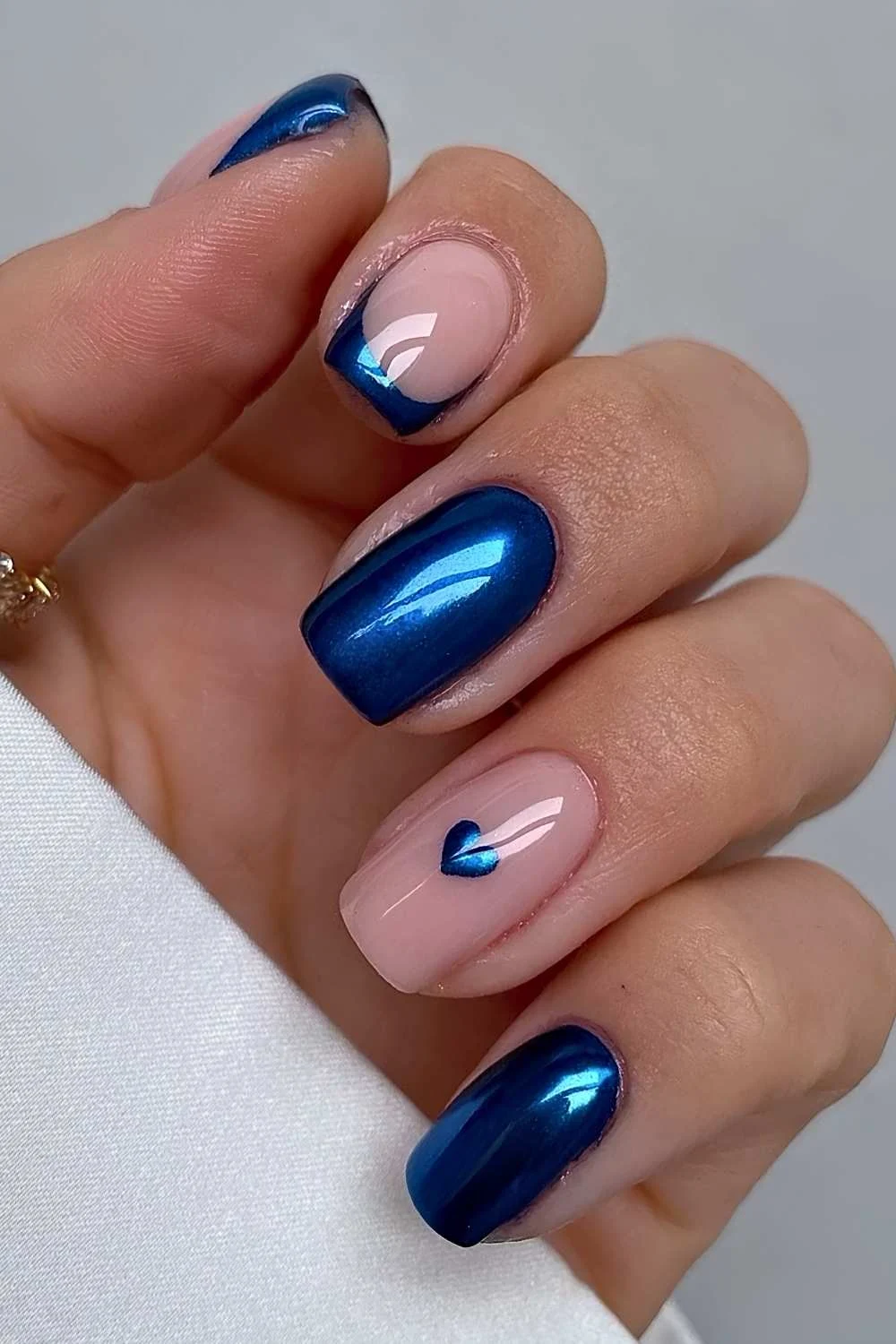 Sapphire blue chrome nails with heart art