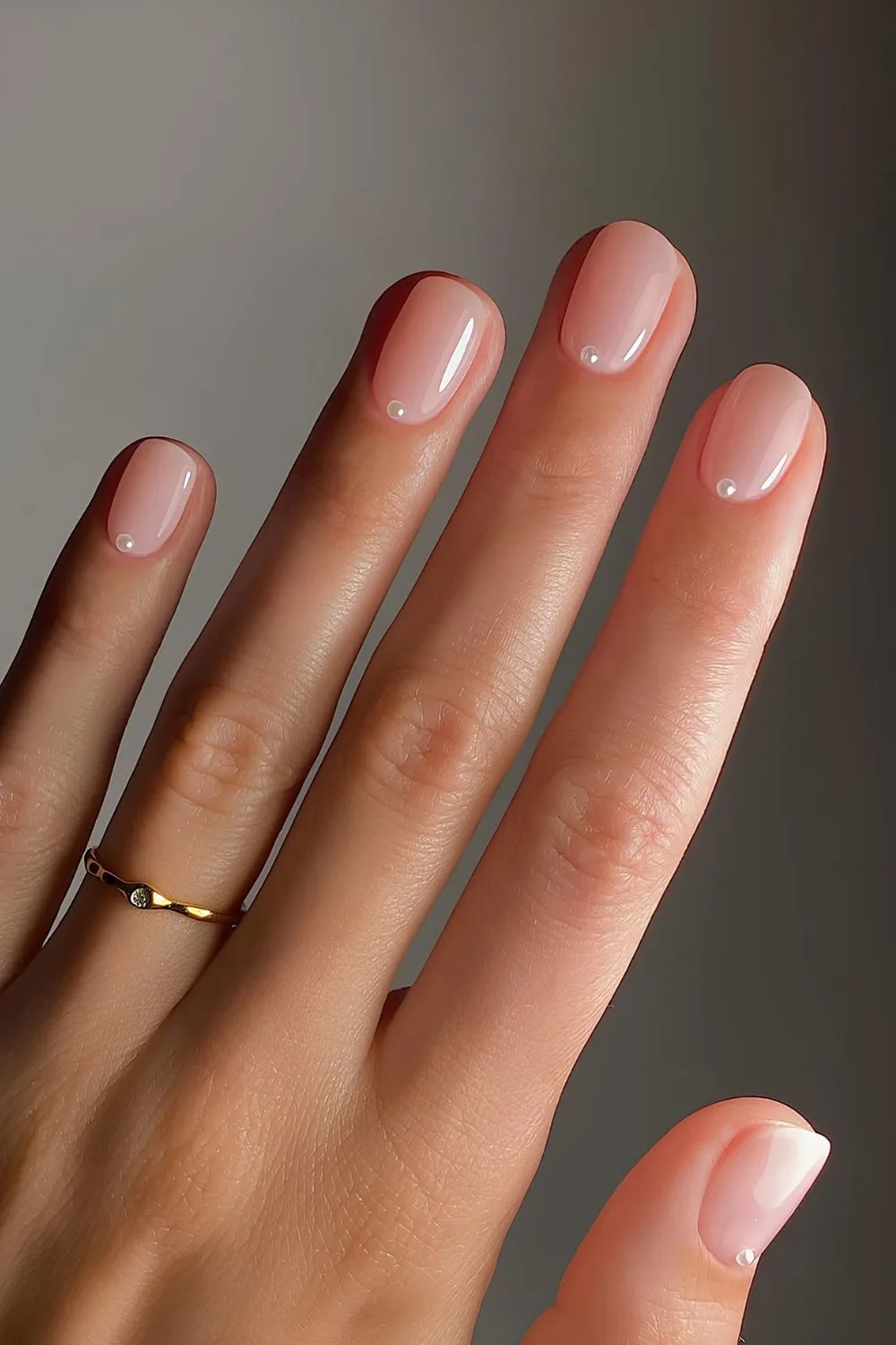 Sheer pink mani with subtle pearl accents