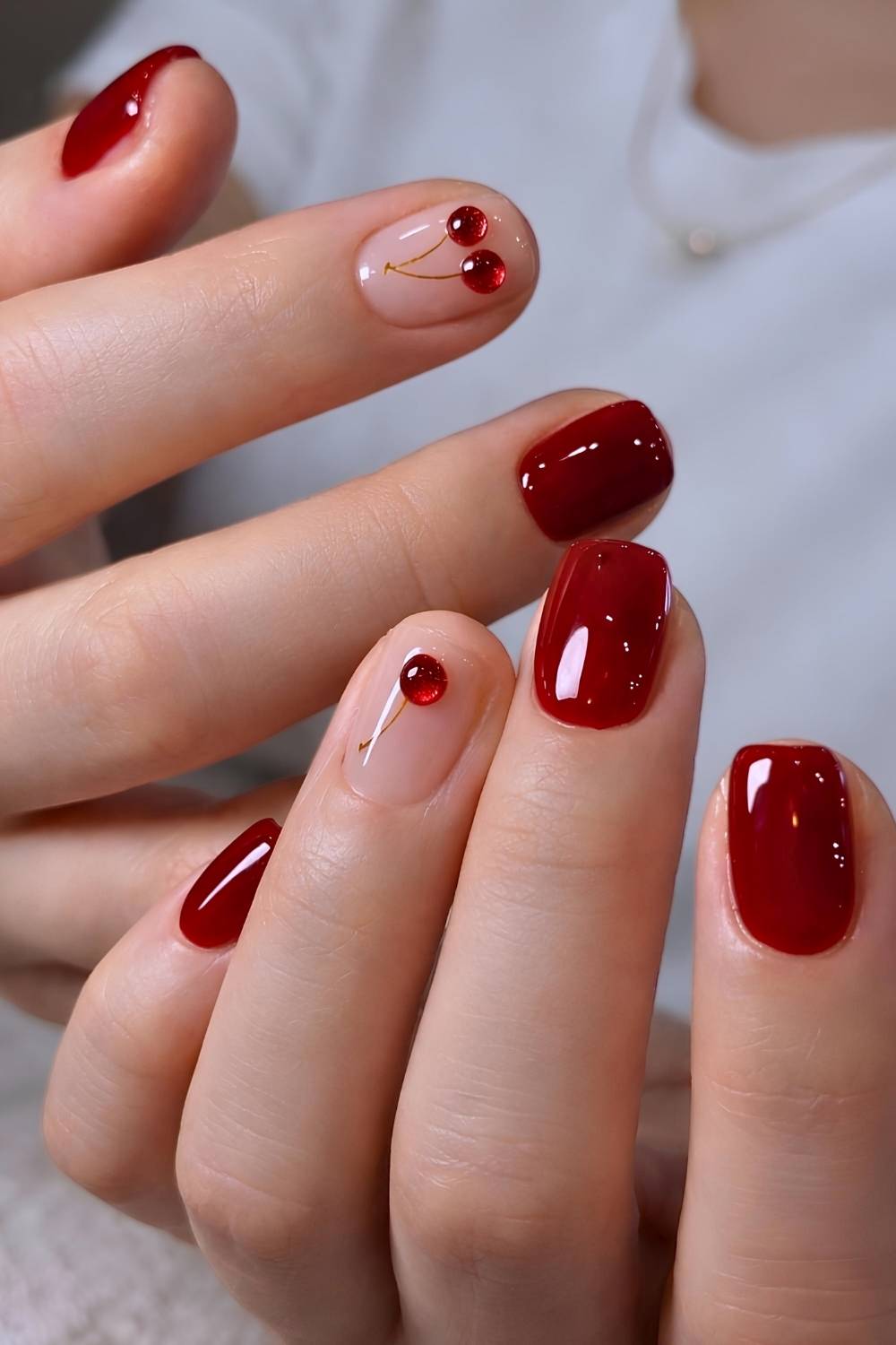 Short red mani with 3d cherry art