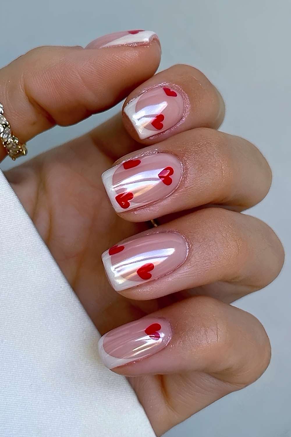Short white chrome French mani with hearts