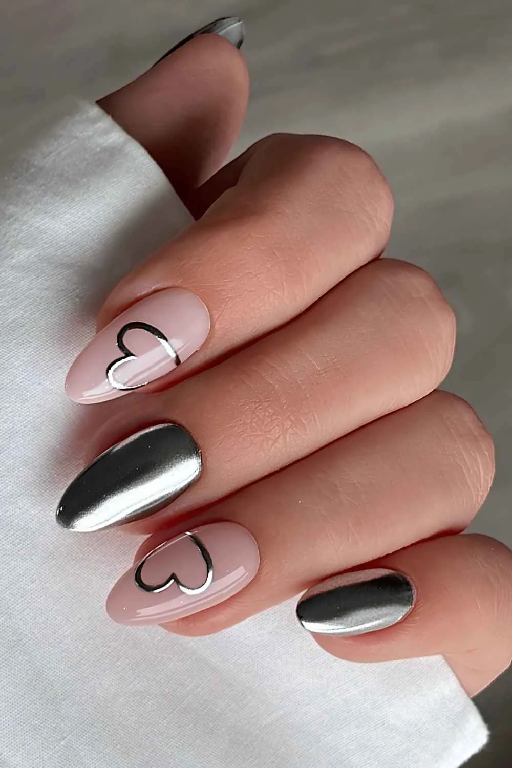 Silver chrome nails with heart art