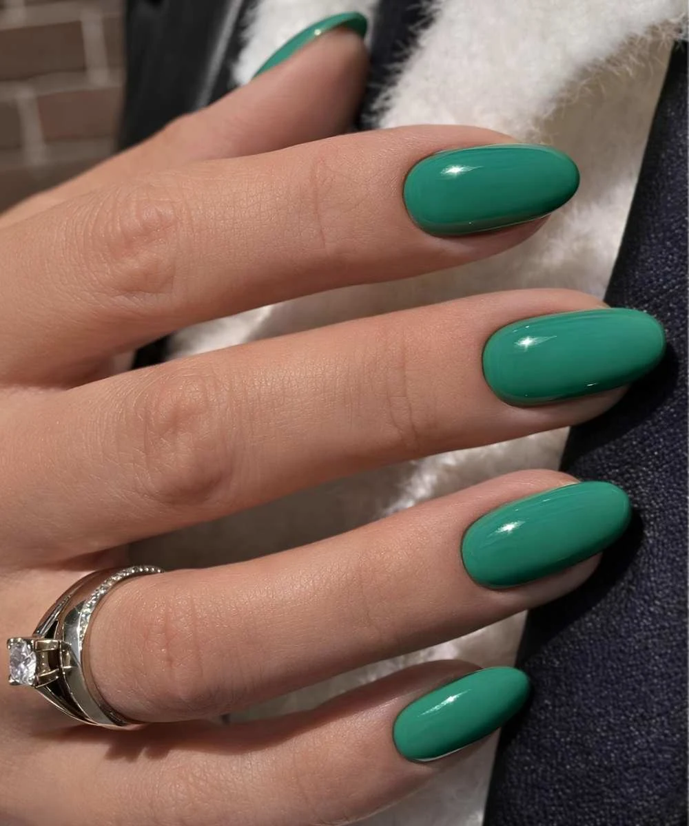 Solid green almond manicure