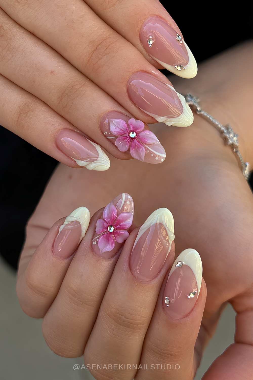 Textured vanilla French nails with pink flowers