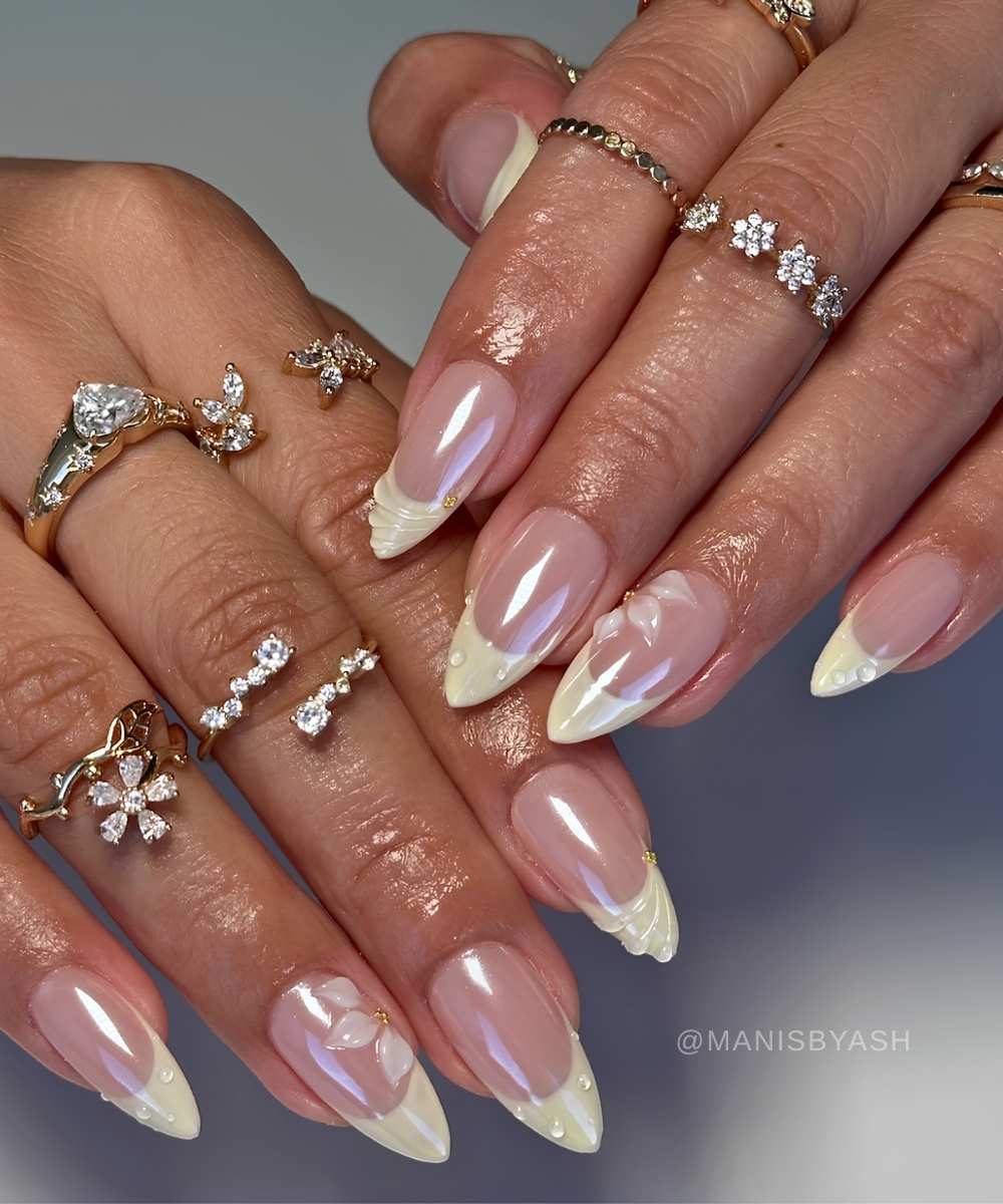 Vanilla chrome French nails with textured flowers