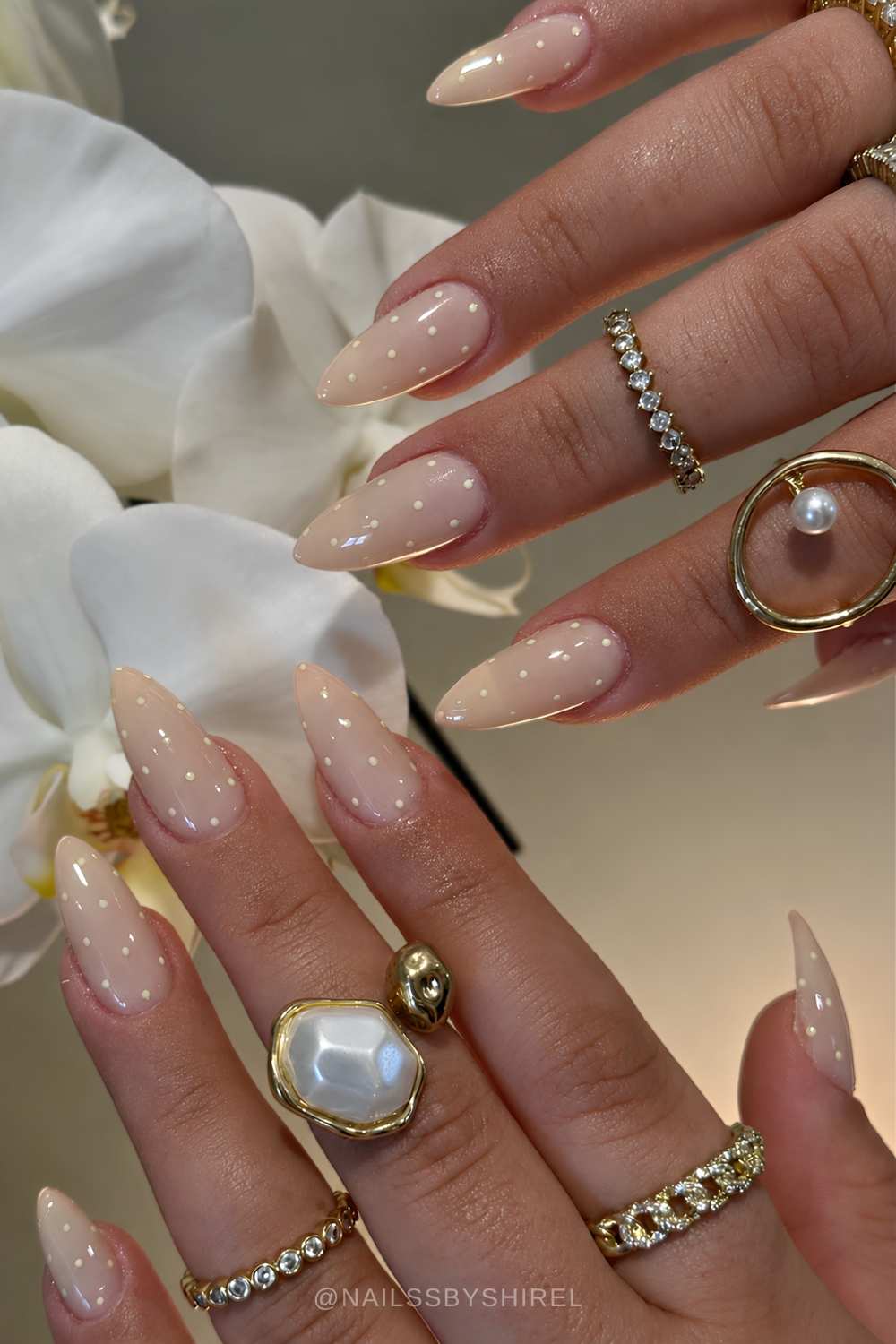 Vanilla nails with white polka dots