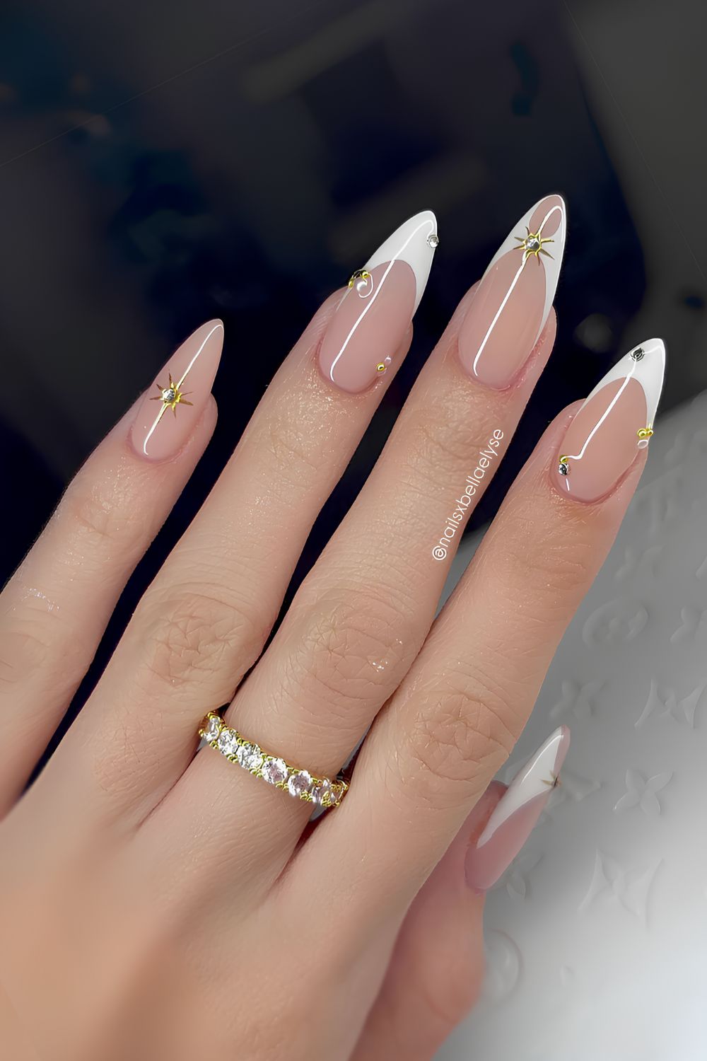 White French manicure with gold celestial accents