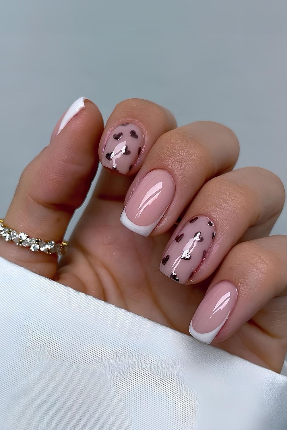 White French nails with chrome hearts