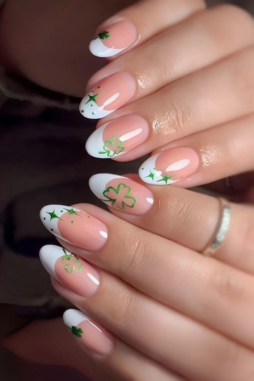 White French nails with clover and star art