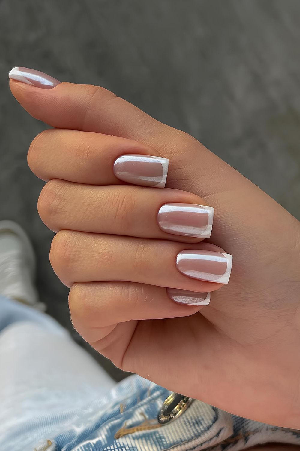 White French tip nails with gray chrome finish