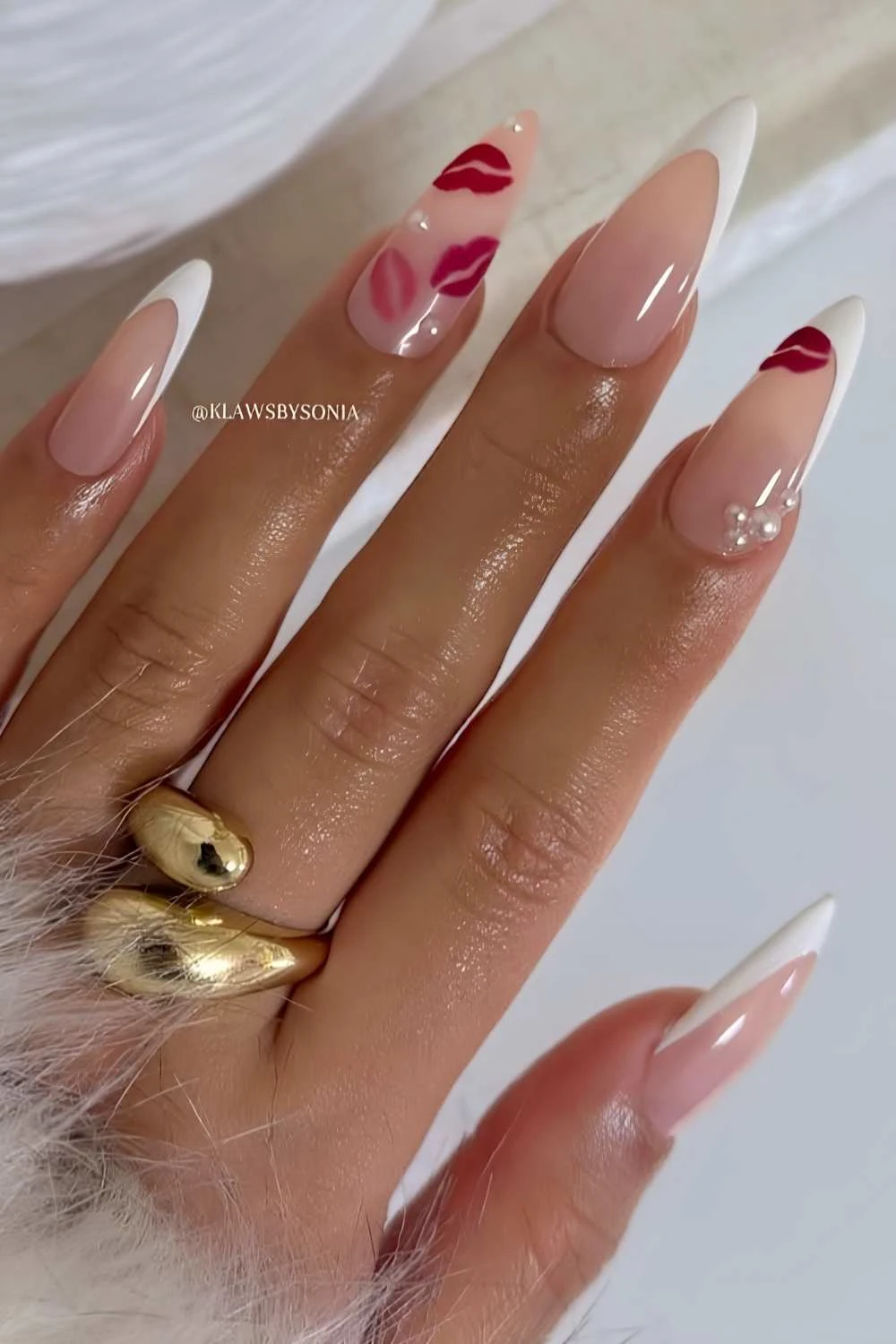 White French tips with micro pearls and kiss art