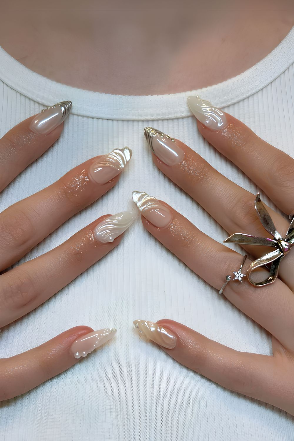 White nails with pearls and silver accents